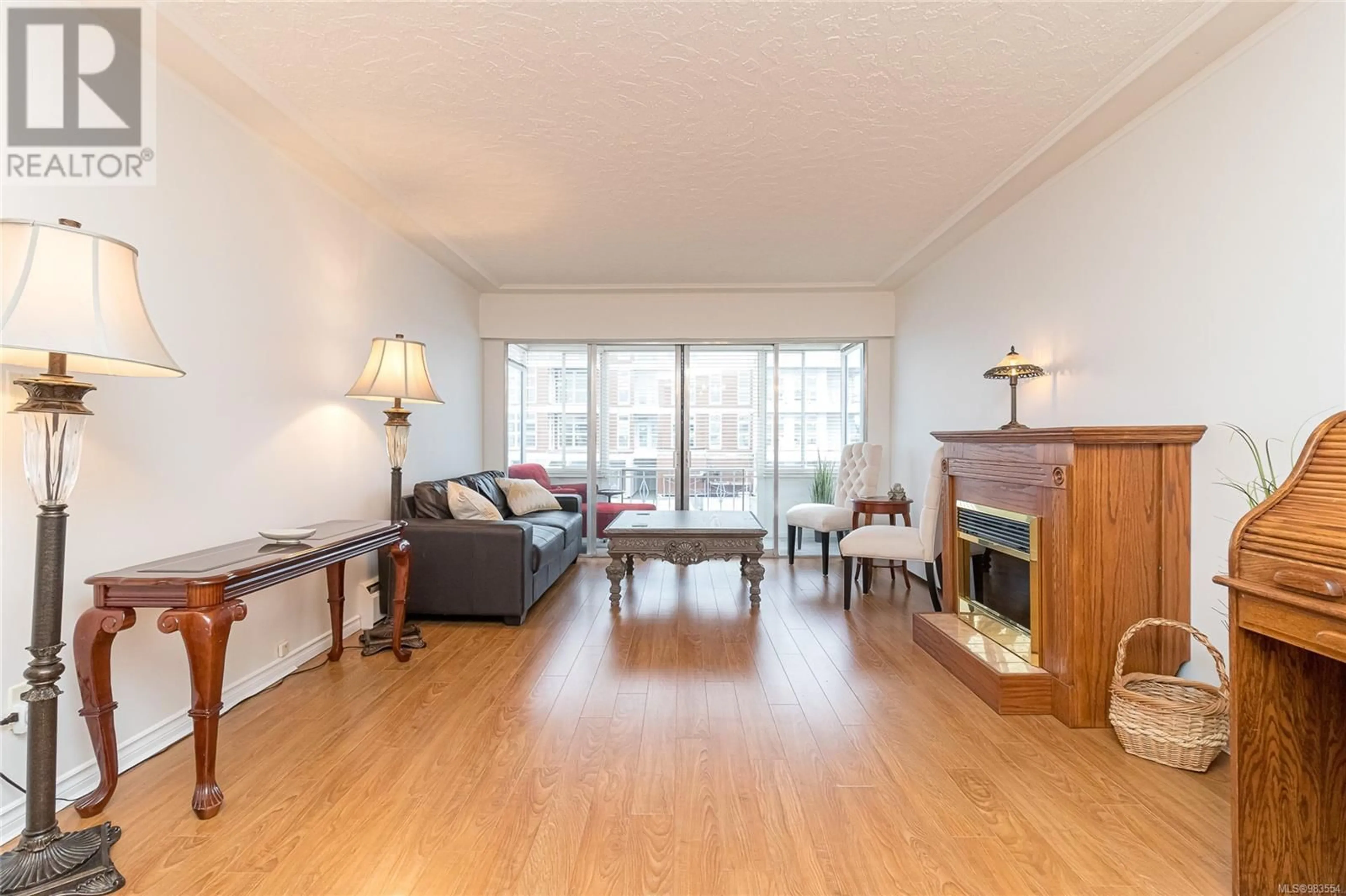 Living room with furniture, wood/laminate floor for 211 9560 Fifth St, Sidney British Columbia V8L2W5