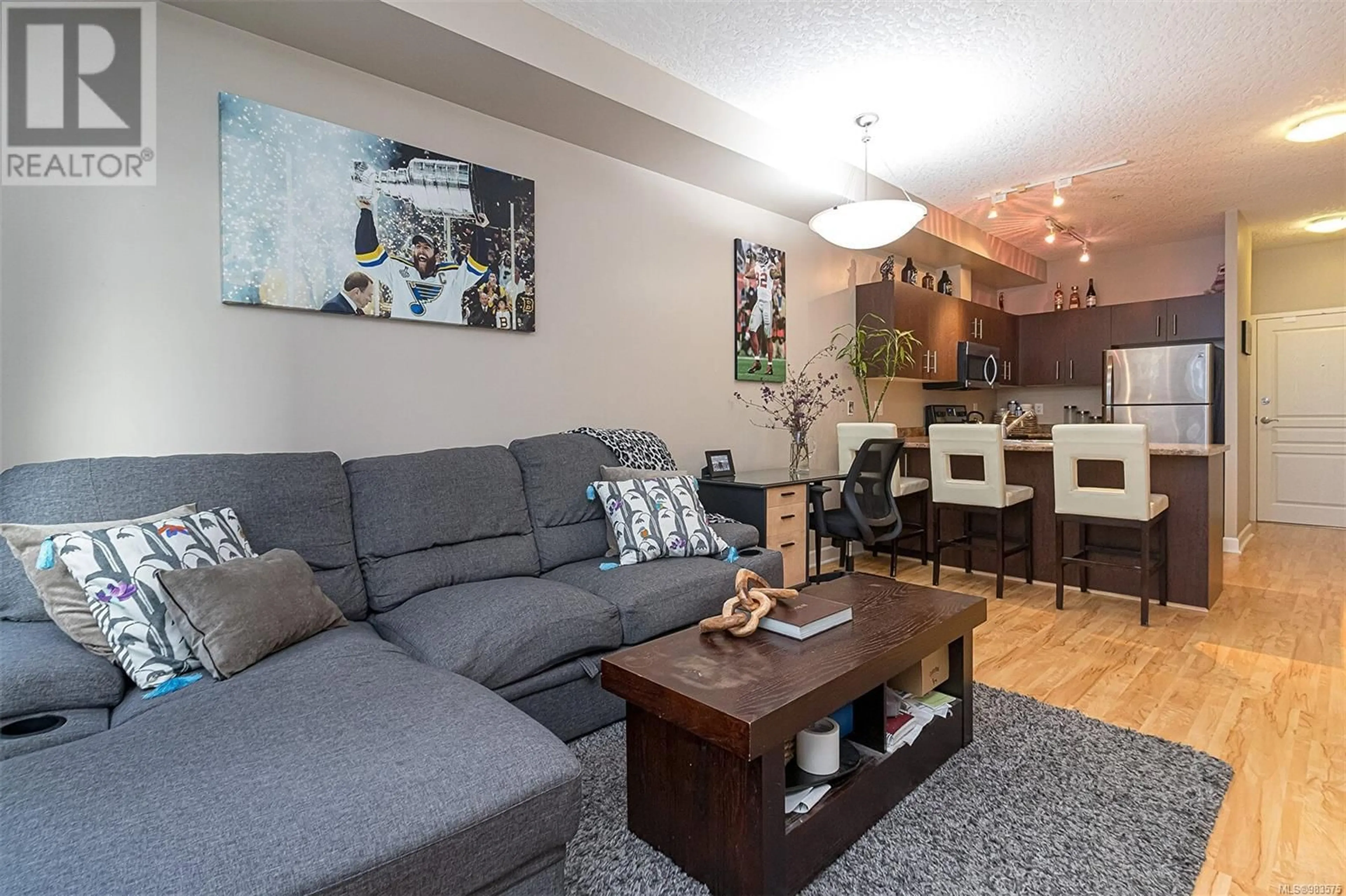 Living room with furniture, wood/laminate floor for 207 825 Goldstream Ave, Langford British Columbia V9B0C3