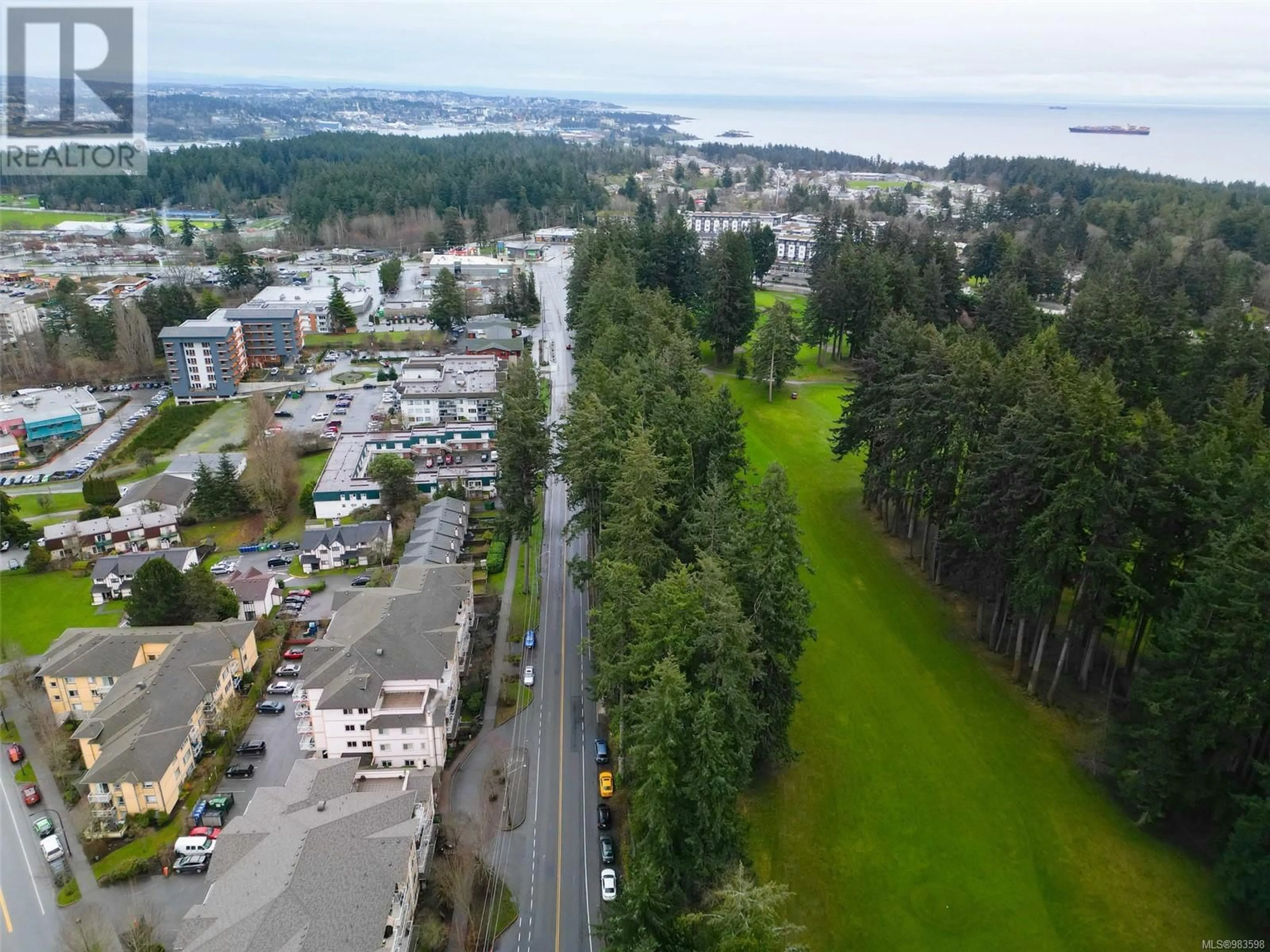 A pic from outside/outdoor area/front of a property/back of a property/a pic from drone, water/lake/river/ocean view for 403 360 Goldstream Ave, Colwood British Columbia V9B2W3