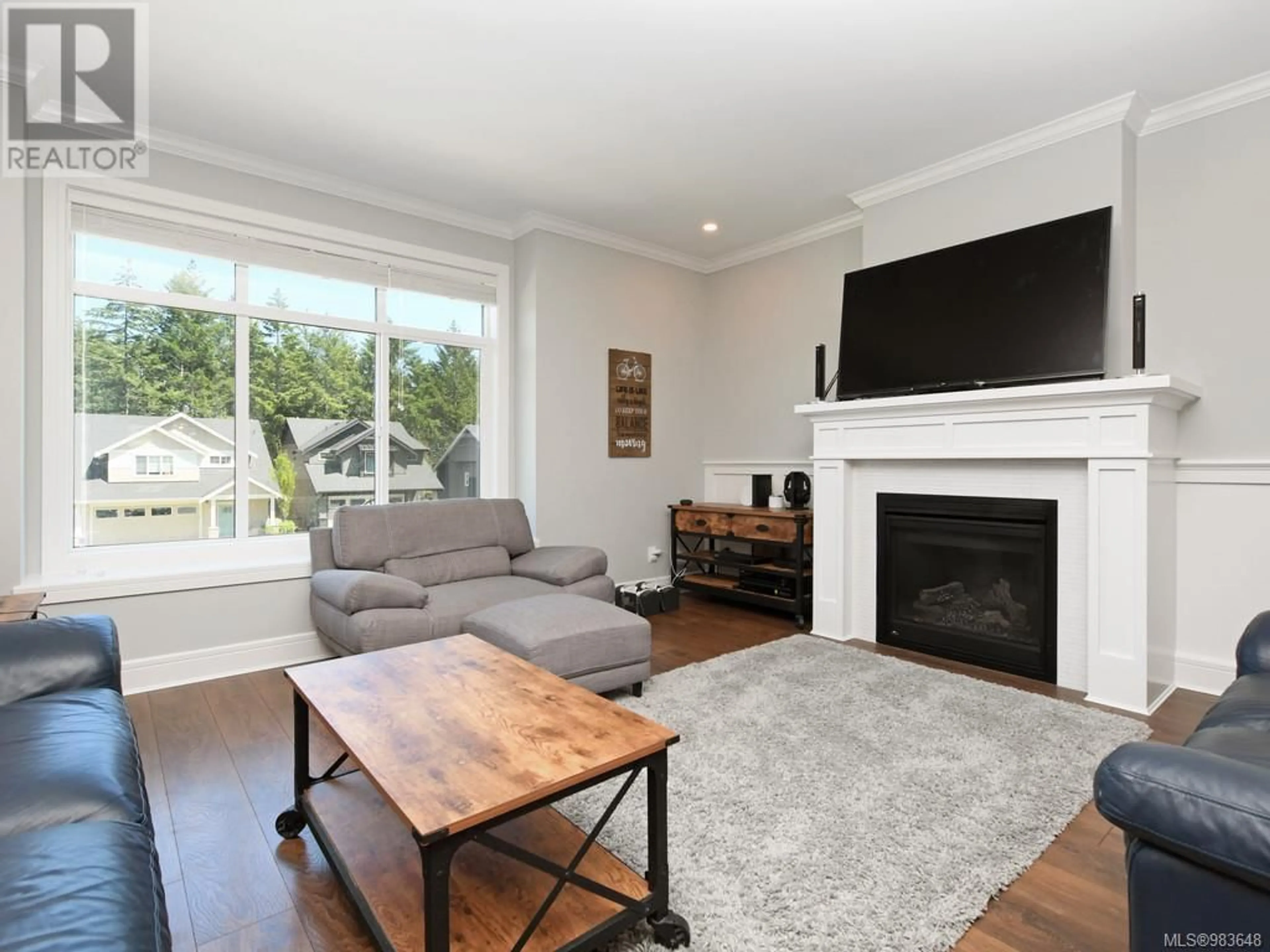 Living room with furniture, wood/laminate floor for 1243 Dreamcatcher Pl, Langford British Columbia V8Z5A3