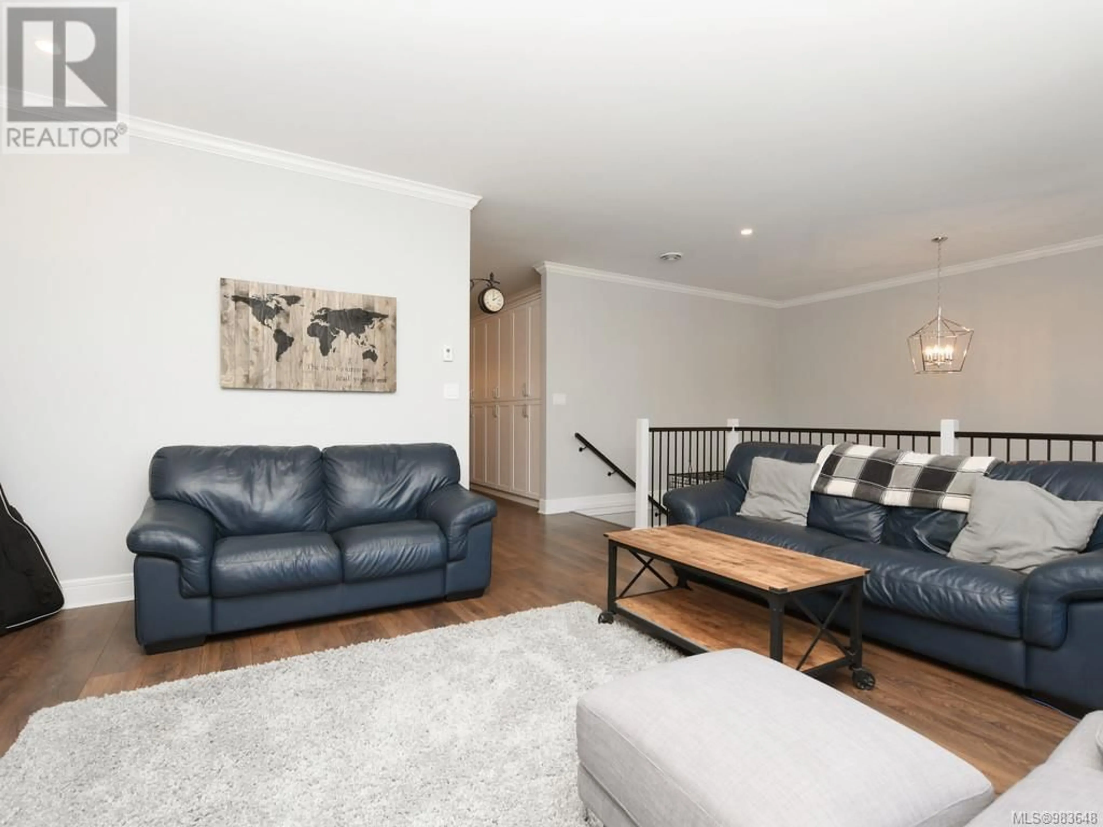 Living room with furniture, wood/laminate floor for 1243 Dreamcatcher Pl, Langford British Columbia V8Z5A3