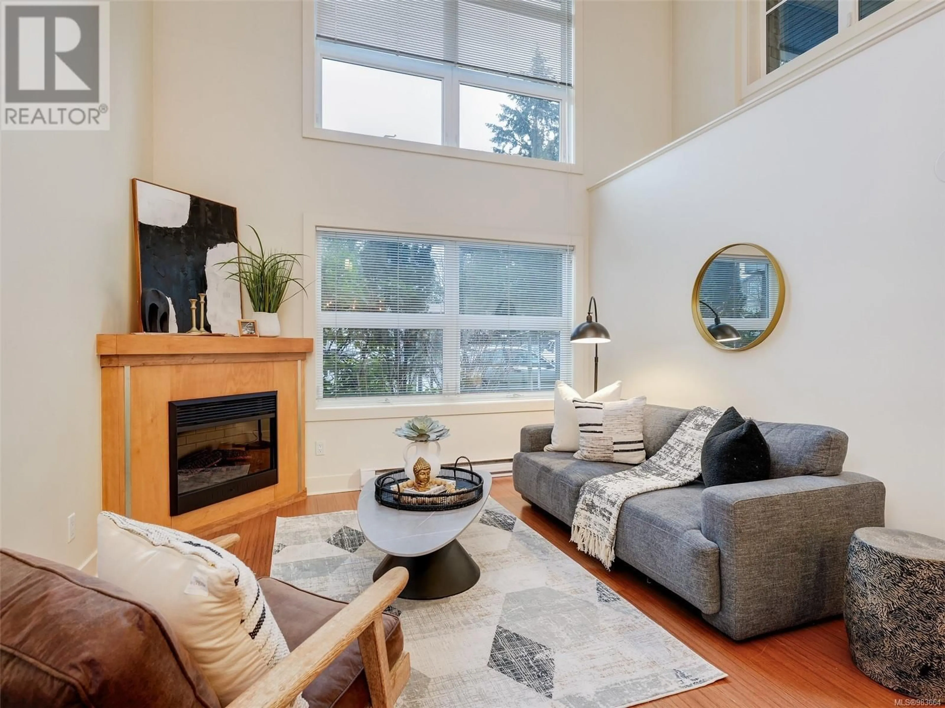 Living room with furniture, wood/laminate floor for 111 2745 Veterans Memorial Pkwy, Langford British Columbia V9B0H4