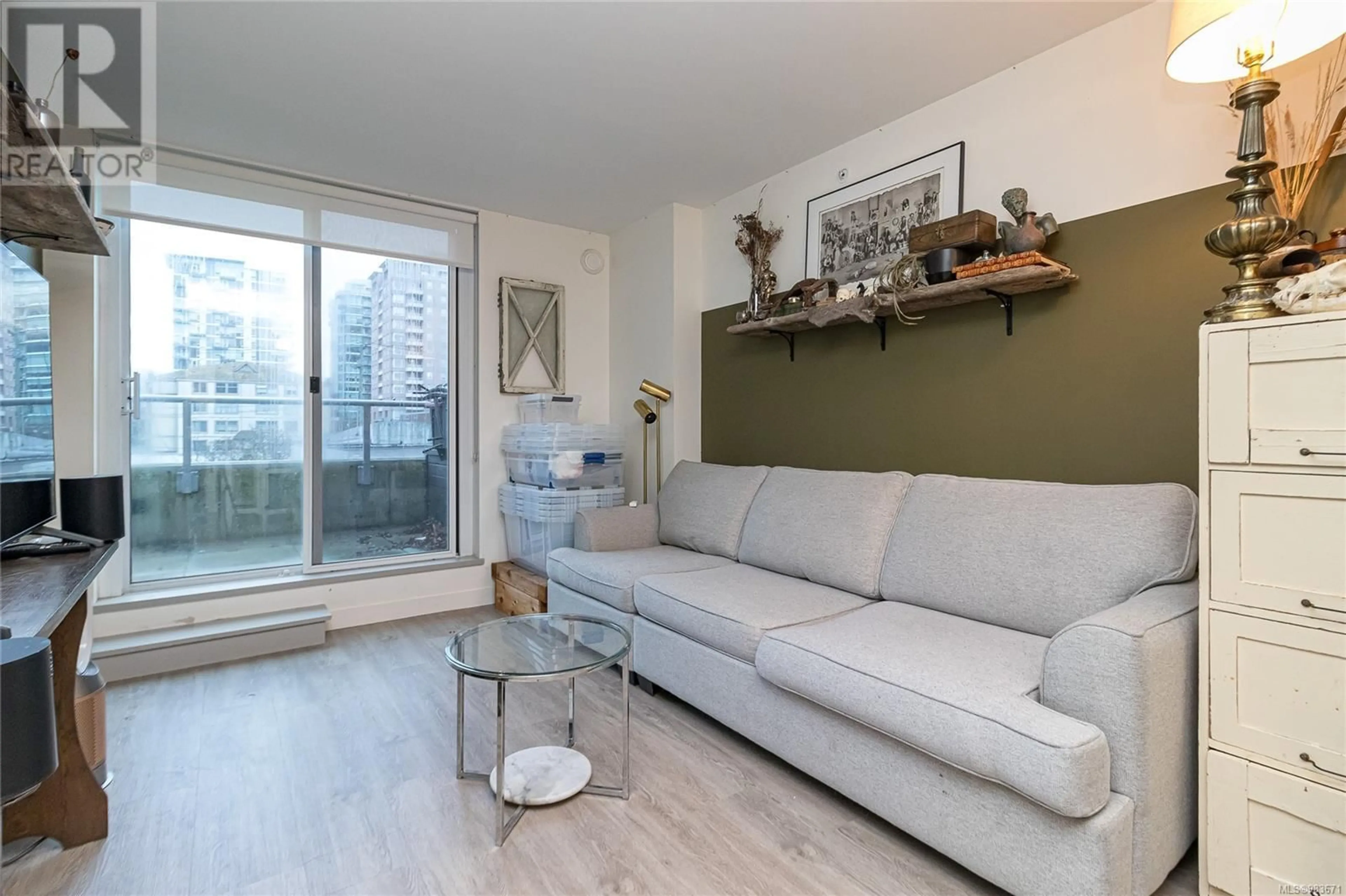 Living room with furniture, wood/laminate floor for 303 845 Johnson St, Victoria British Columbia V8W0G3