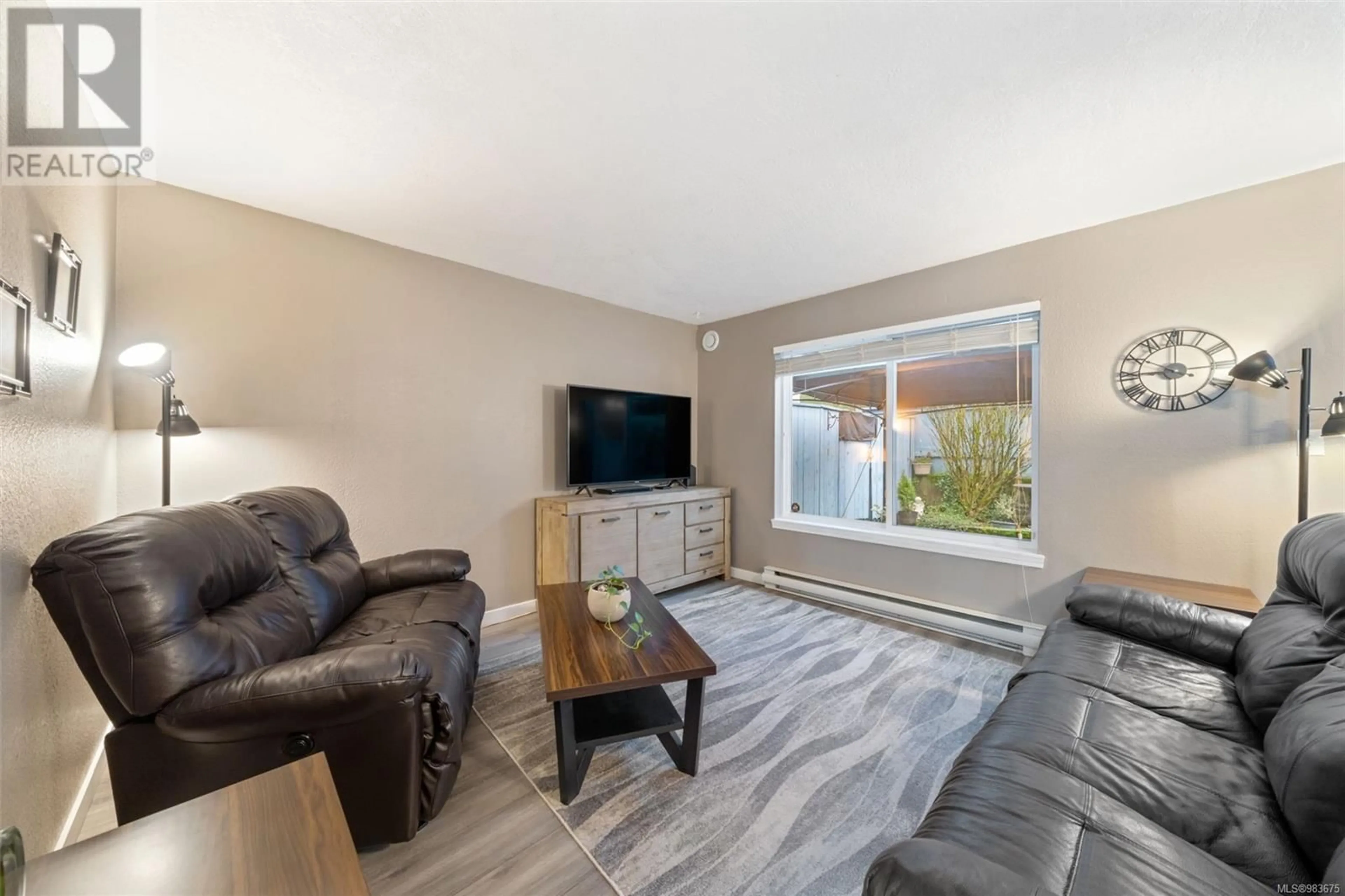 Living room with furniture, wood/laminate floor for 6 215 Madill Rd, Lake Cowichan British Columbia V0R2G0