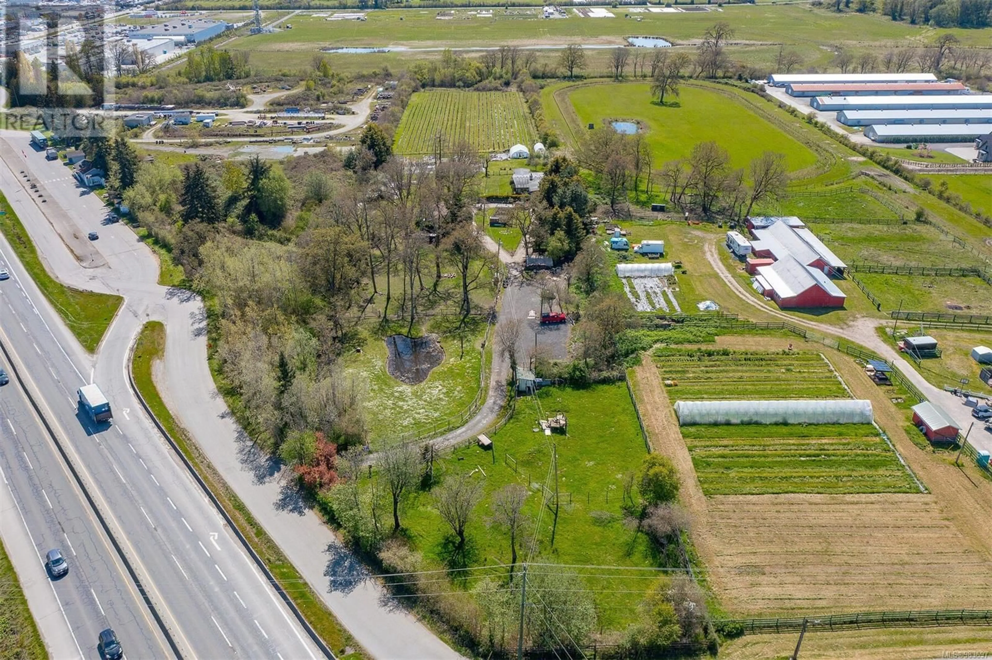 A pic from outside/outdoor area/front of a property/back of a property/a pic from drone, street for 1899 JOHN ROAD, North Saanich British Columbia V8L5S8