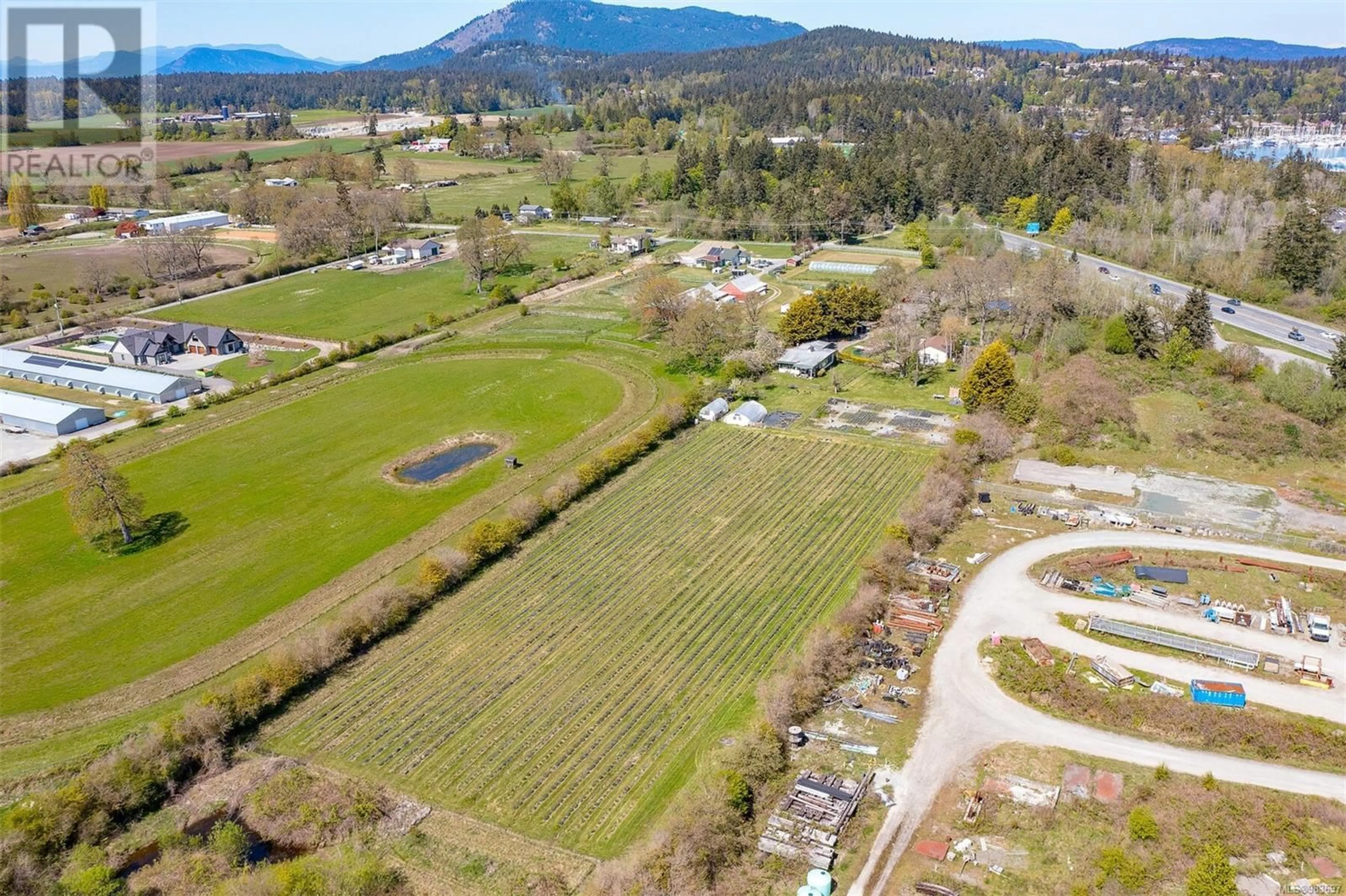 A pic from outside/outdoor area/front of a property/back of a property/a pic from drone, mountain view for 1899 JOHN ROAD, North Saanich British Columbia V8L5S8