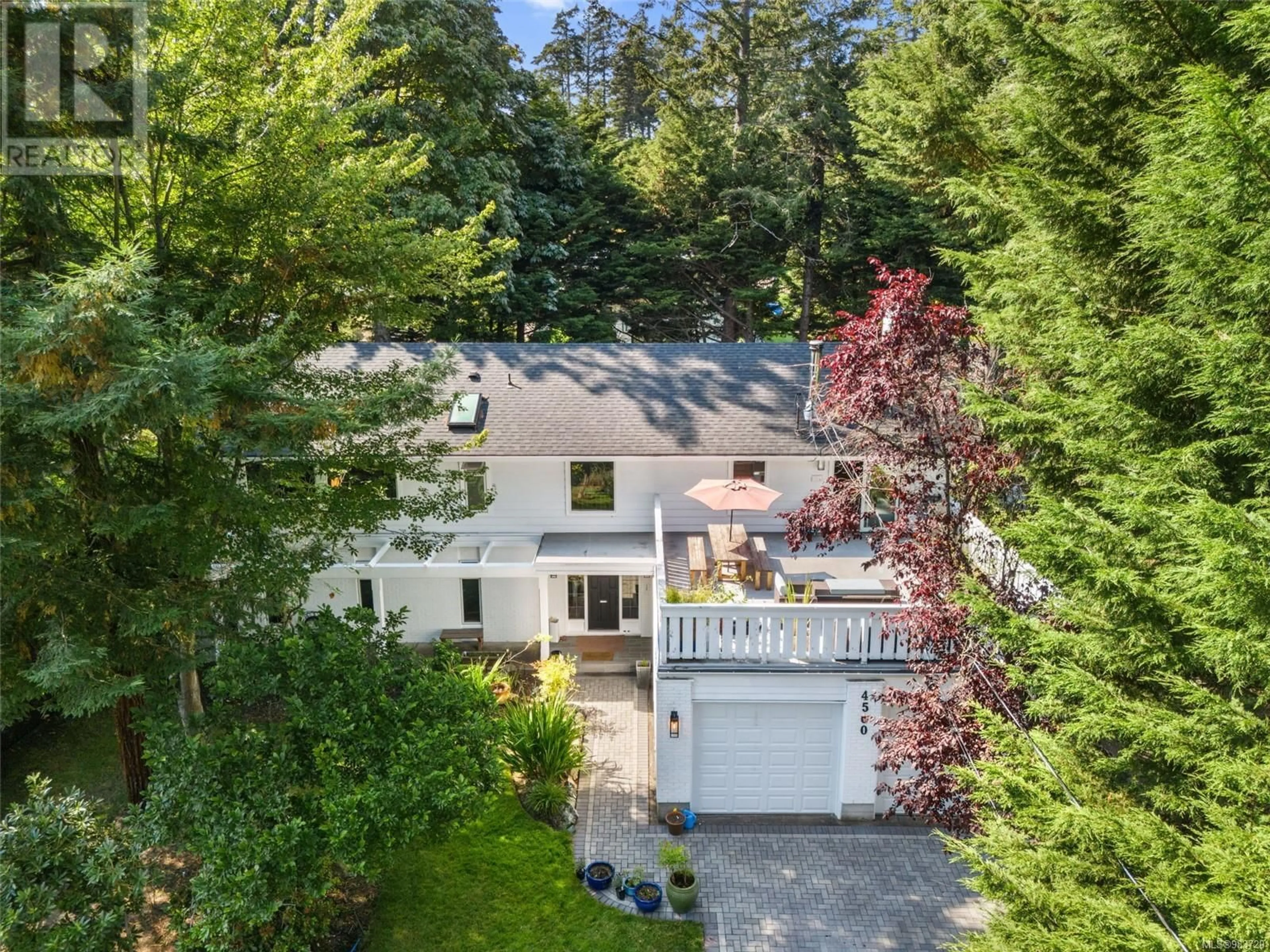 A pic from outside/outdoor area/front of a property/back of a property/a pic from drone, street for 4560 Balmacarra Rd, Saanich British Columbia V8N3W3