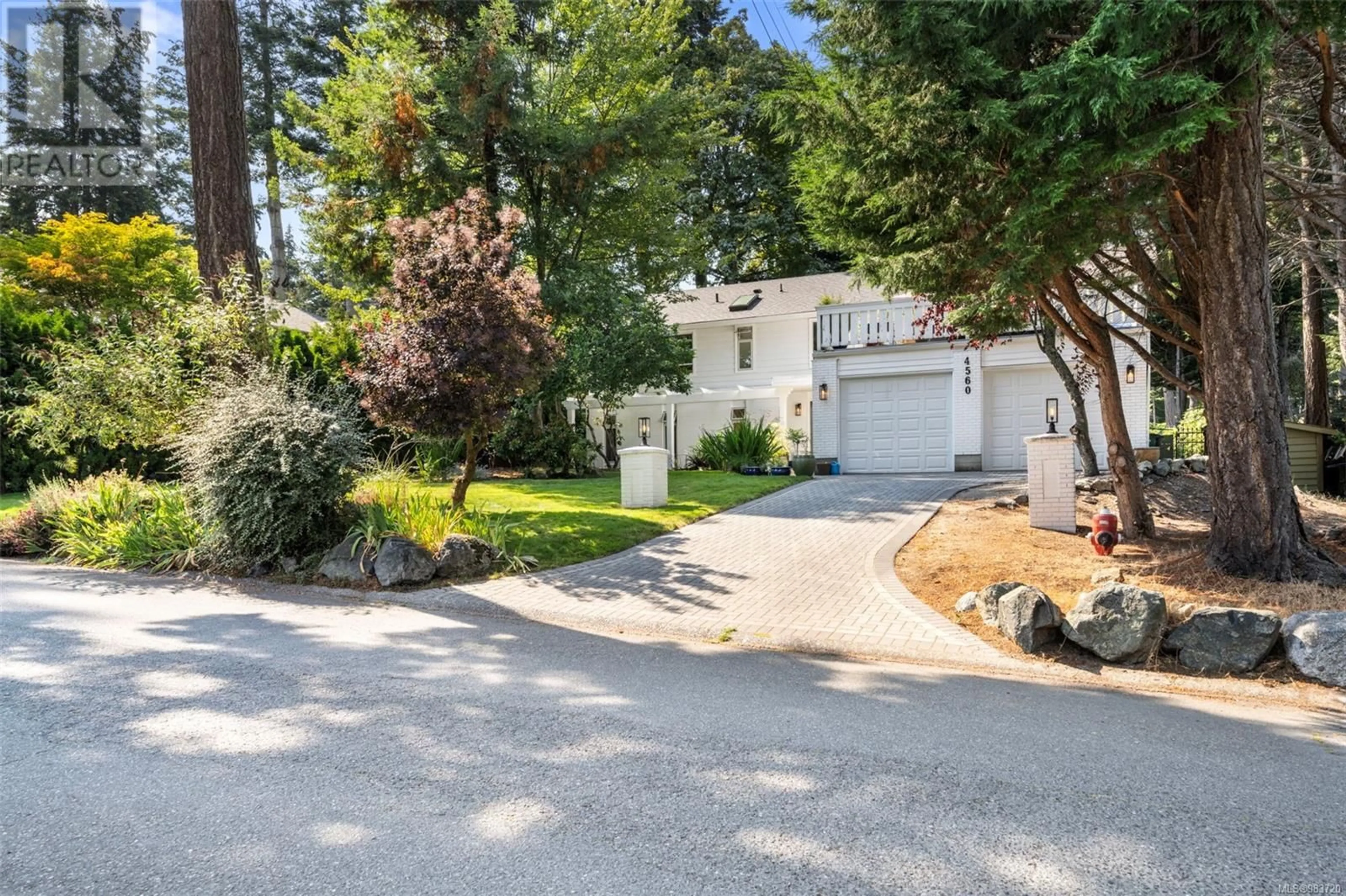 A pic from outside/outdoor area/front of a property/back of a property/a pic from drone, street for 4560 Balmacarra Rd, Saanich British Columbia V8N3W3