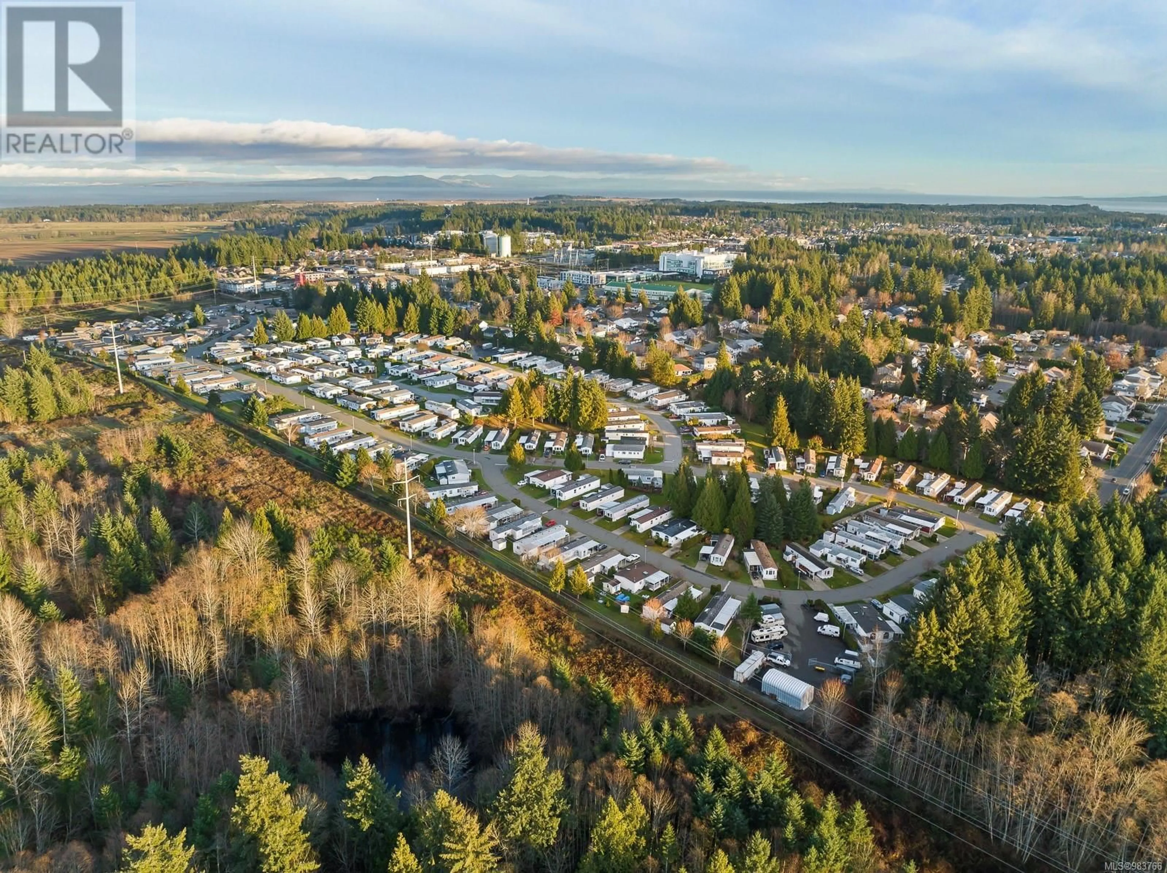 A pic from outside/outdoor area/front of a property/back of a property/a pic from drone, mountain view for 124 4714 Muir Rd, Courtenay British Columbia V9N8Z6