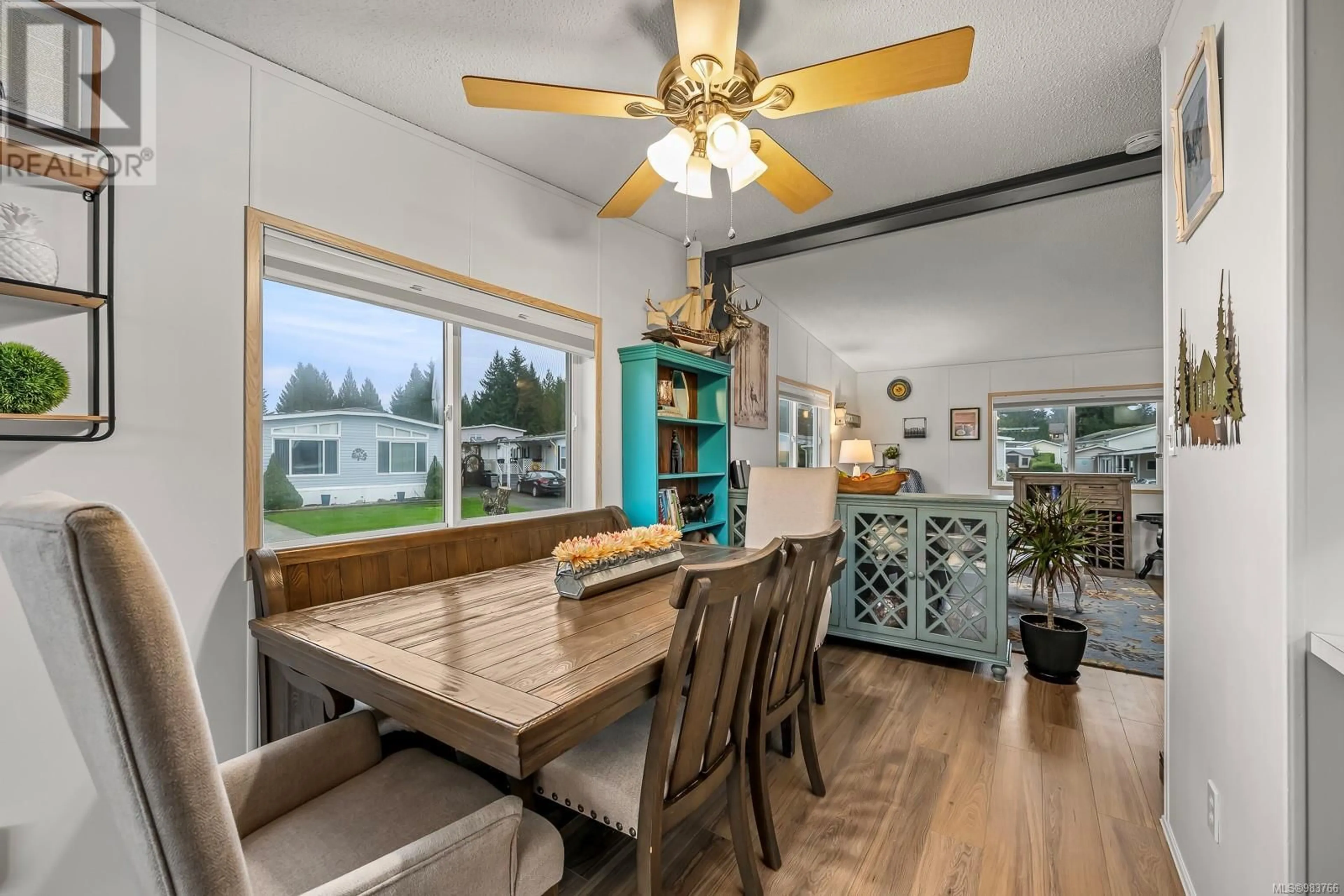 Open concept kitchen, wood/laminate floor for 124 4714 Muir Rd, Courtenay British Columbia V9N8Z6