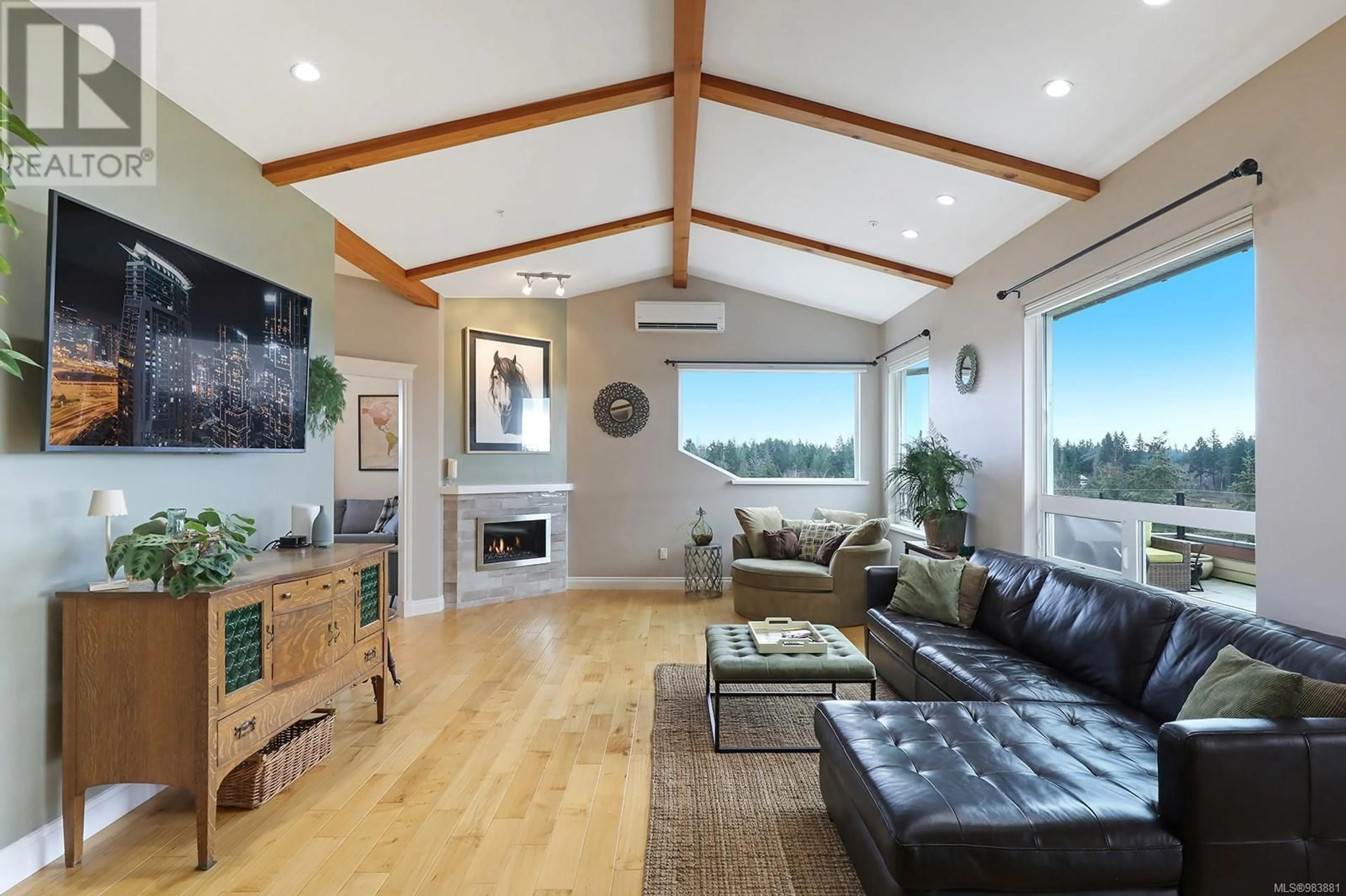 Living room with furniture, wood/laminate floor for 643 3666 Royal Vista Way, Courtenay British Columbia V9N9X8