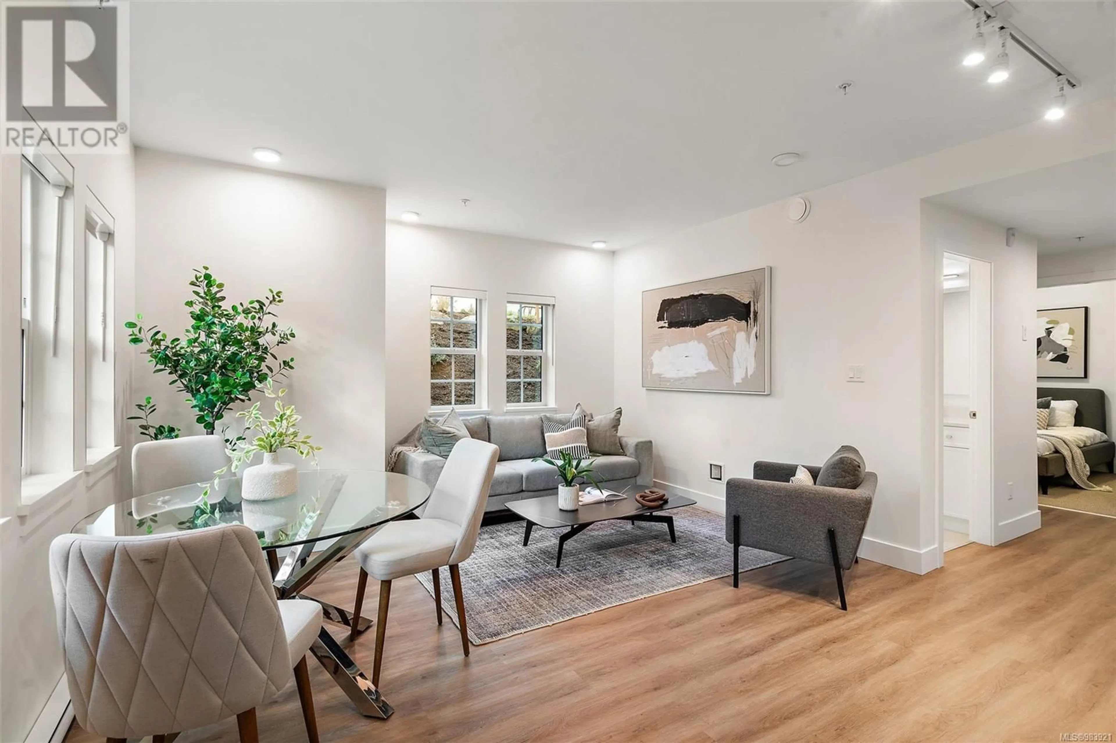 Living room with furniture, wood/laminate floor for 101B 1224 Richardson St, Victoria British Columbia V8V3E1