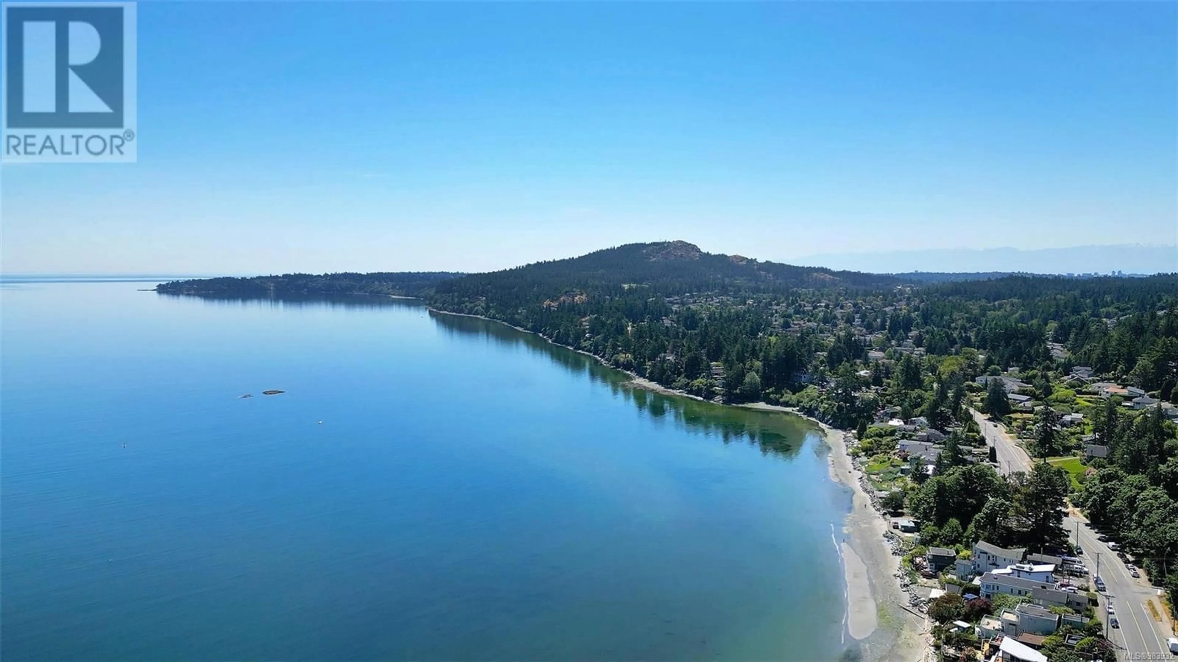 A pic from outside/outdoor area/front of a property/back of a property/a pic from drone, water/lake/river/ocean view for 306 5120 Cordova Bay Rd, Saanich British Columbia V8Y2K5