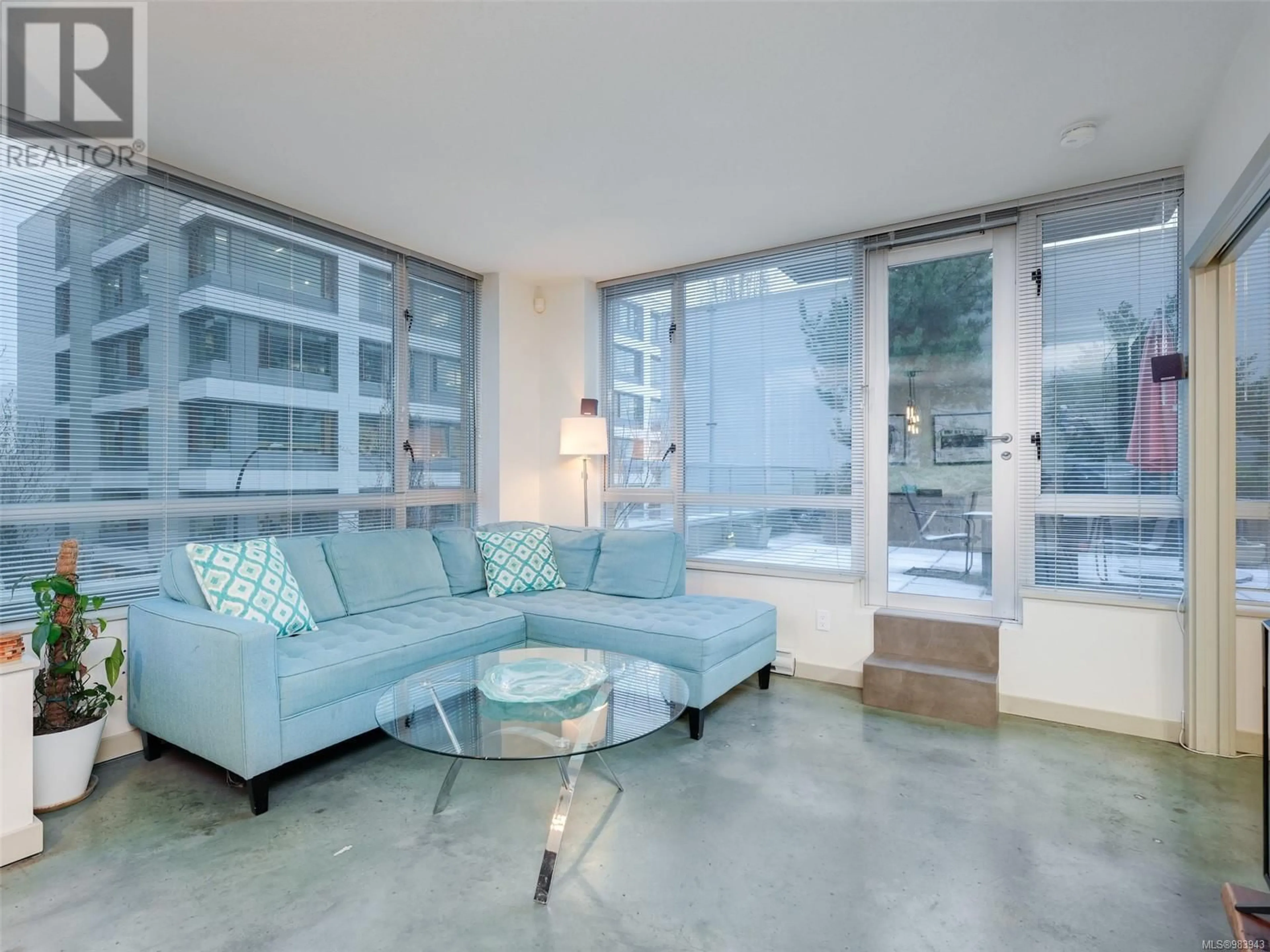 Living room with furniture, cement floor for 307 732 Cormorant St, Victoria British Columbia V8W4A5