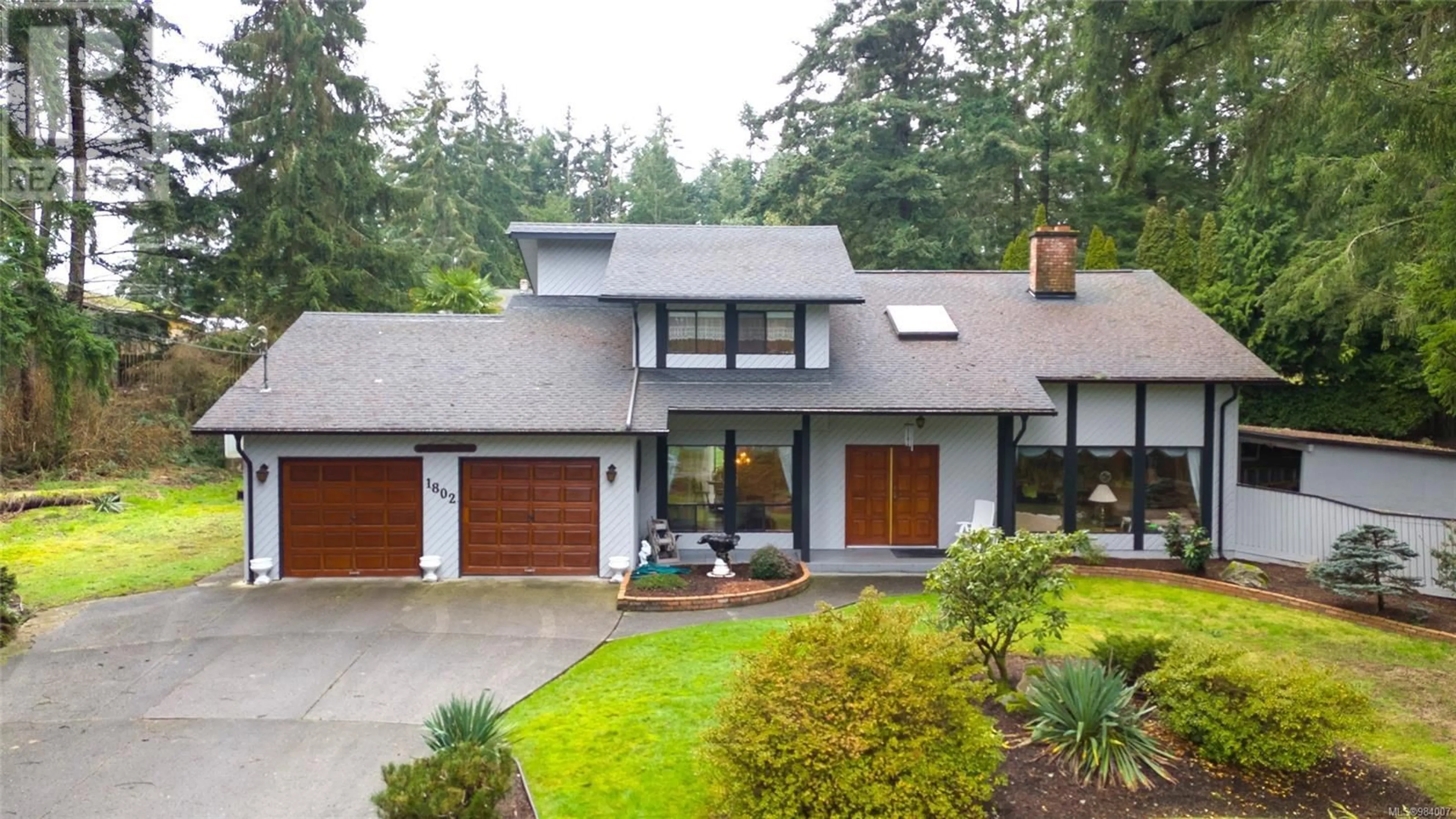 Home with vinyl exterior material, street for 1802 Amelia Cres, Nanoose Bay British Columbia V9P9C7