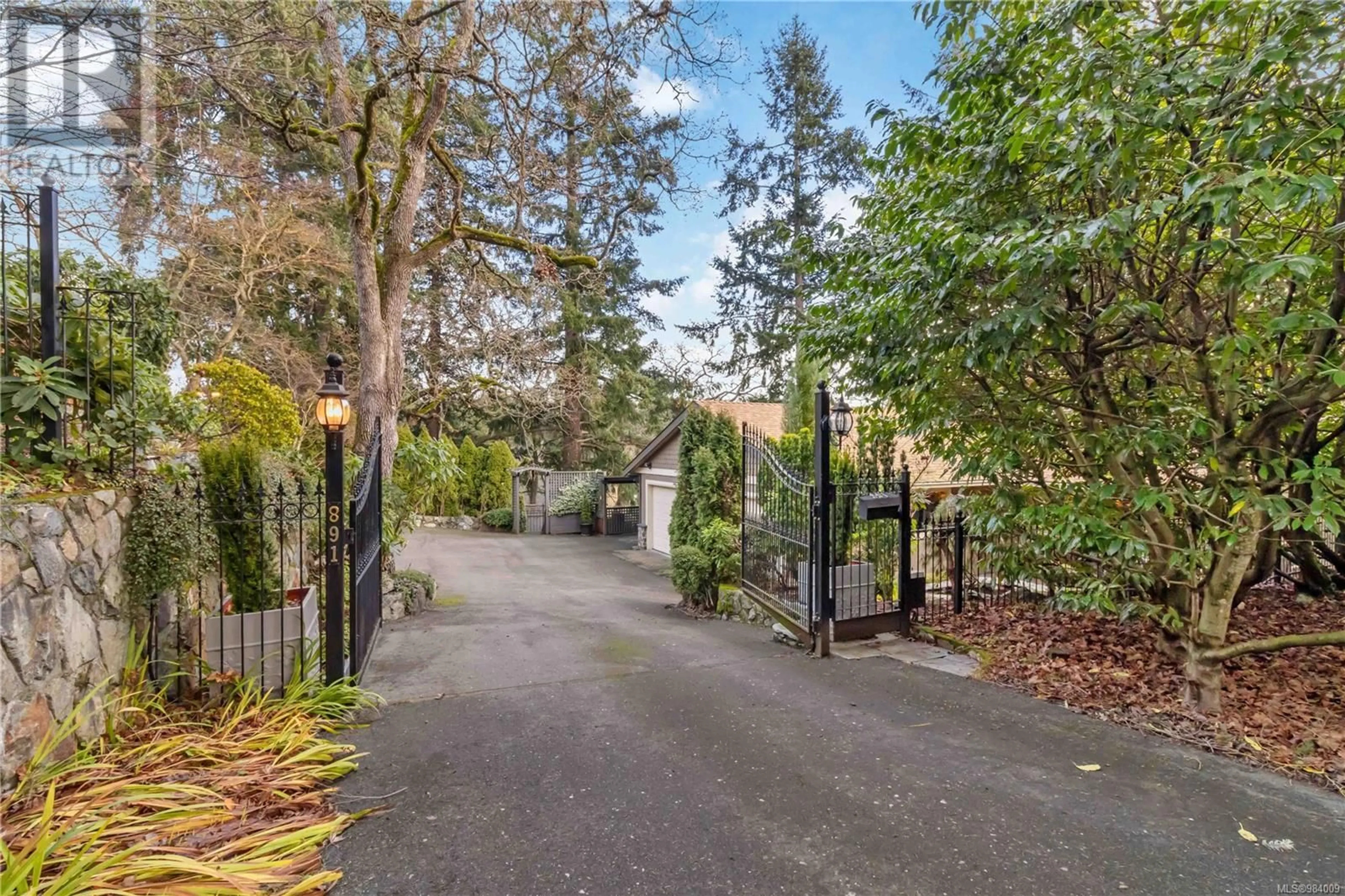 A pic from outside/outdoor area/front of a property/back of a property/a pic from drone, street for 891 Royal Oak Dr, Saanich British Columbia V8X5H5