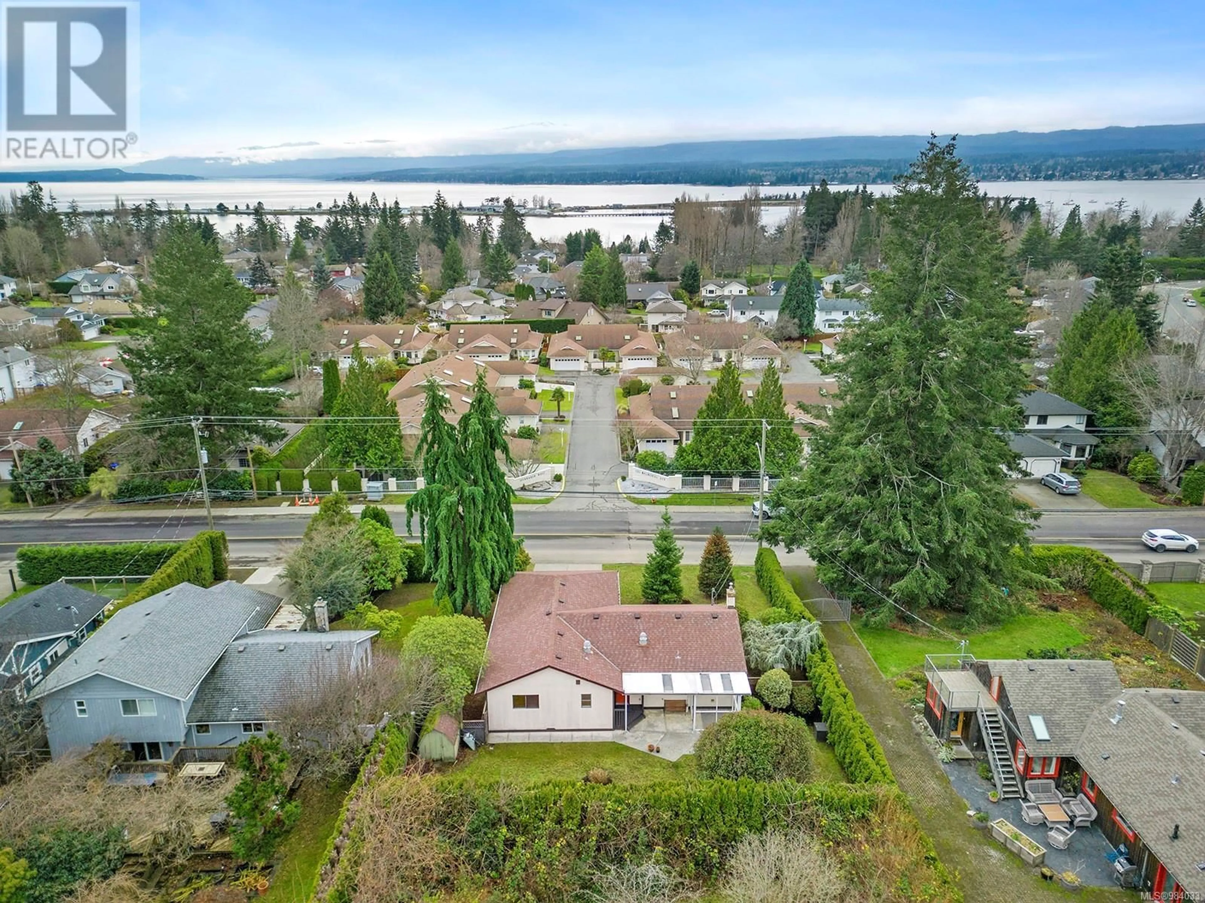 A pic from outside/outdoor area/front of a property/back of a property/a pic from drone, water/lake/river/ocean view for 1496 Balmoral Ave, Comox British Columbia V9M2P6