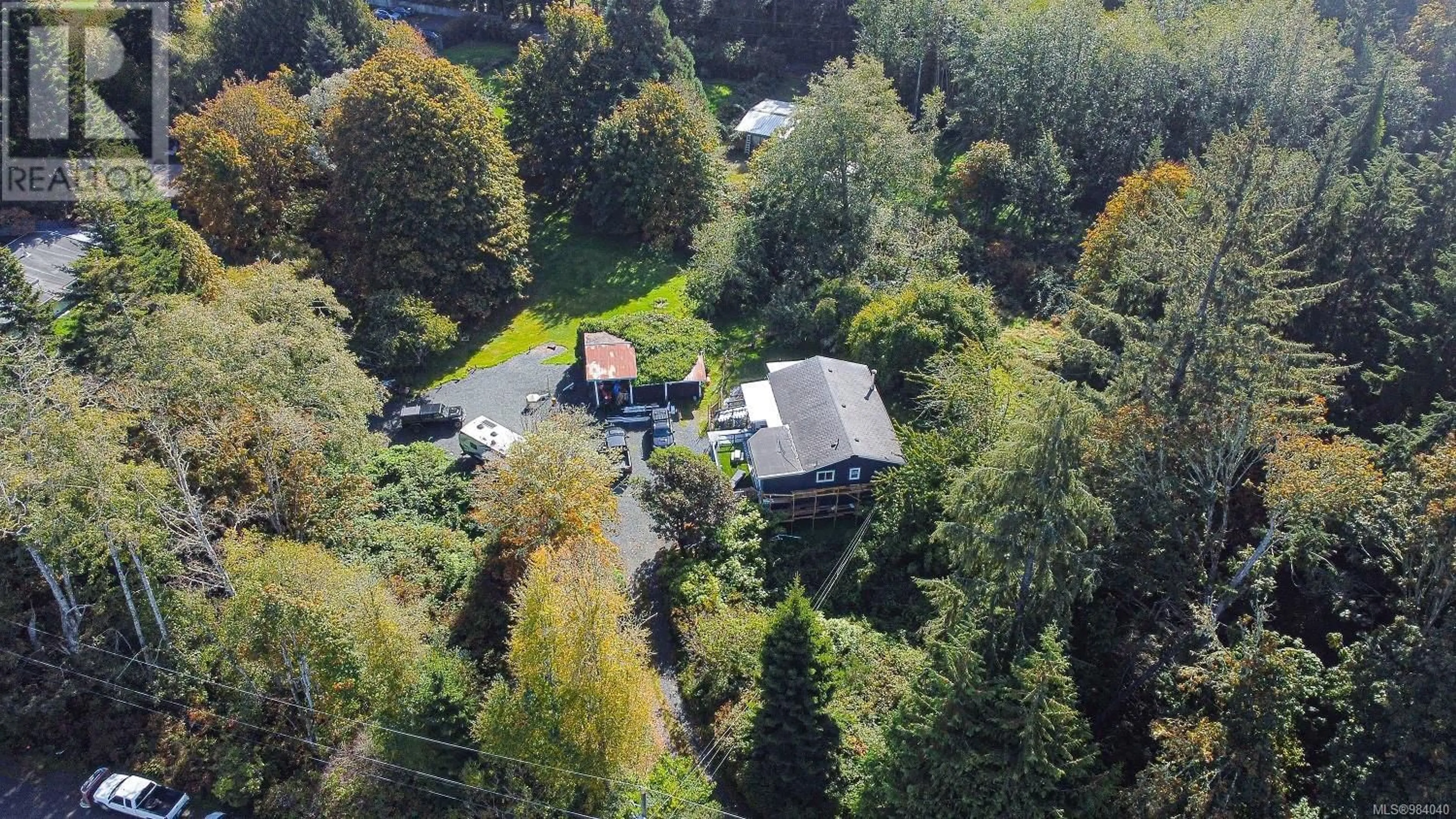 A pic from outside/outdoor area/front of a property/back of a property/a pic from drone, forest/trees view for 7015 Wright Rd, Sooke British Columbia V9Z1M5