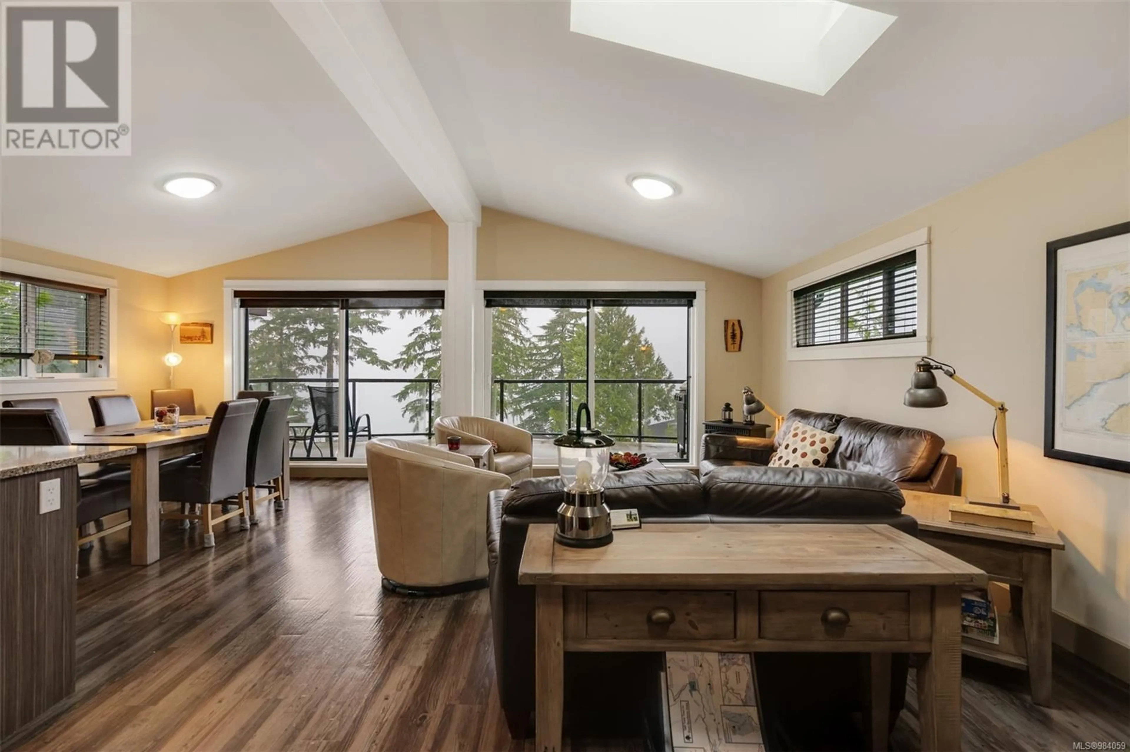 Living room with furniture, wood/laminate floor for 245 6596 Baird Rd, Port Renfrew British Columbia V0S1K0