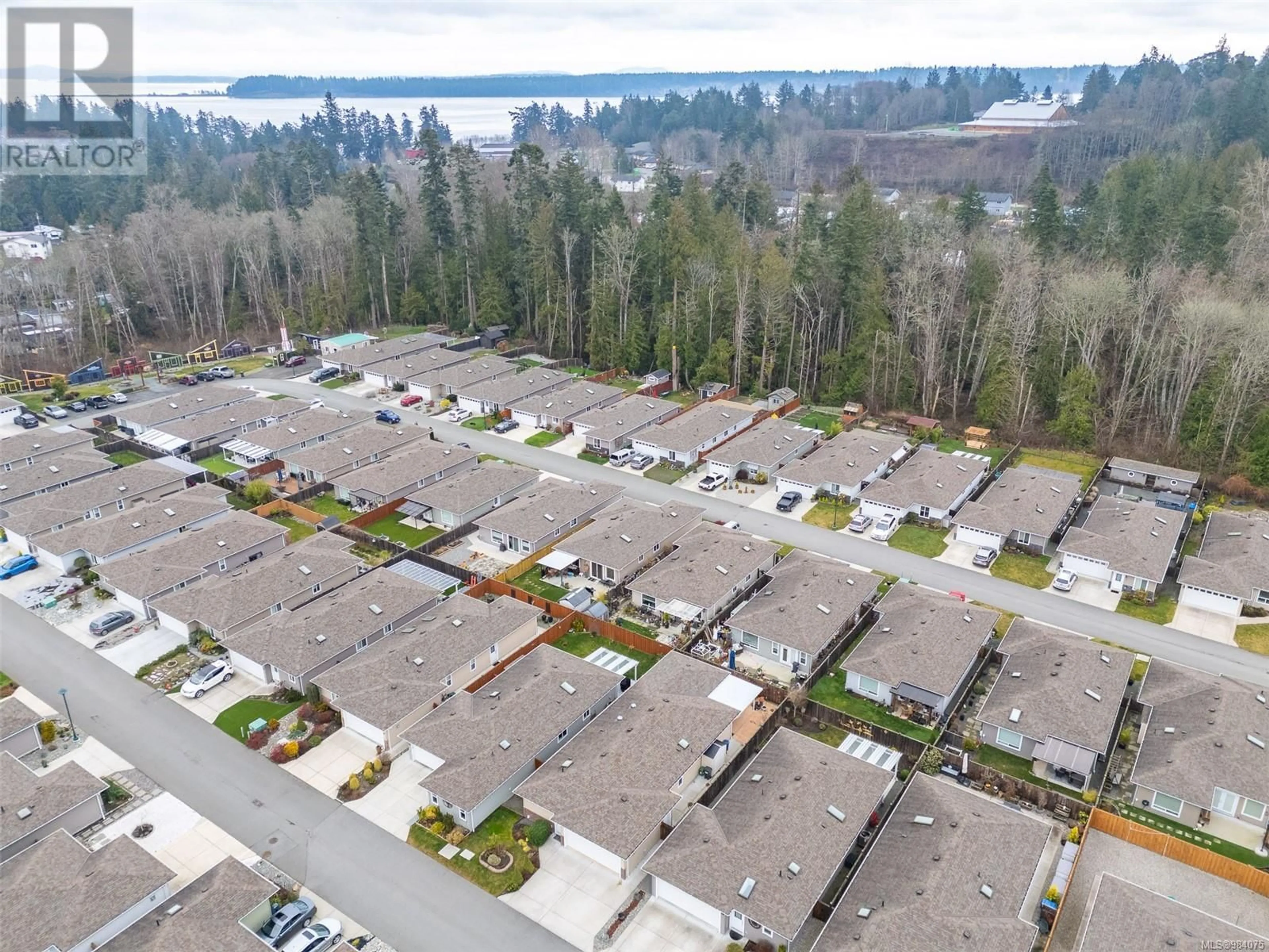 A pic from outside/outdoor area/front of a property/back of a property/a pic from drone, street for 12 7586 Tetayut Rd, Central Saanich British Columbia V8M0B4