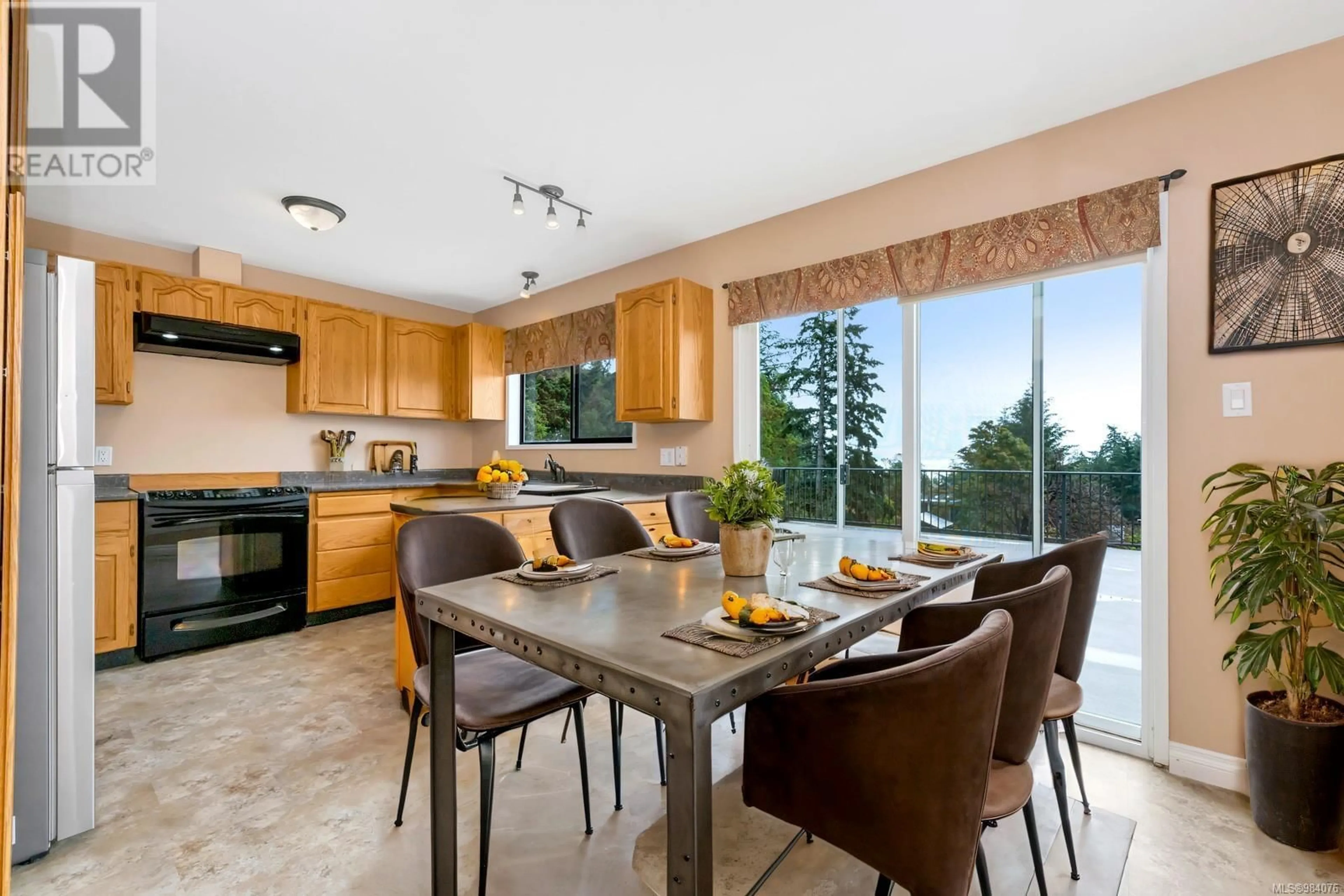 Open concept kitchen, ceramic/tile floor for 544 Windthrop Rd, Colwood British Columbia V9C3B5