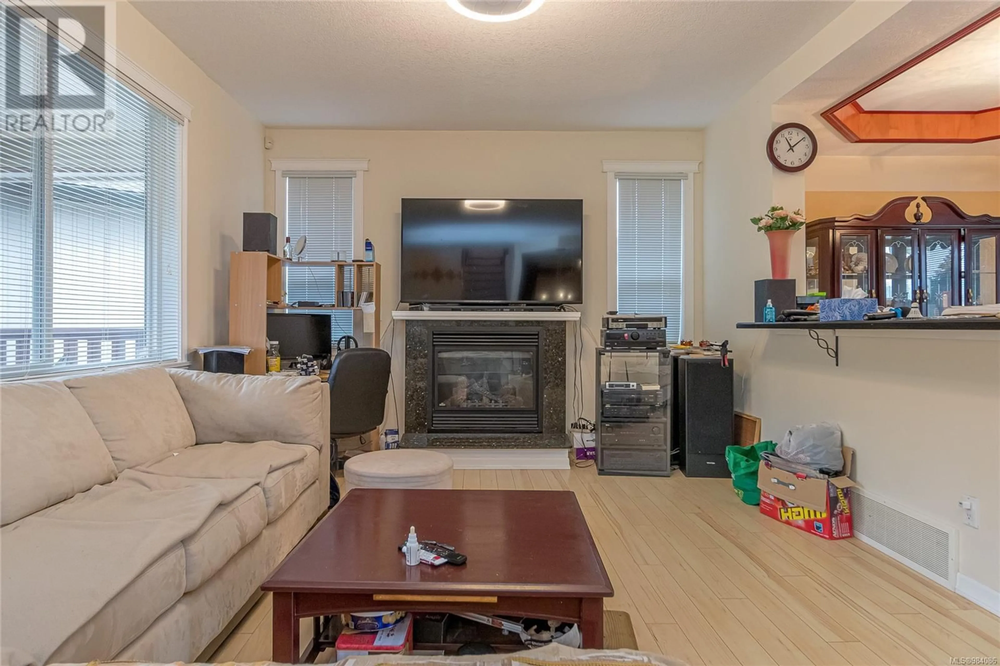 Living room with furniture, wood/laminate floor for 6183 Dennie Lane, Nanaimo British Columbia V9T0A5