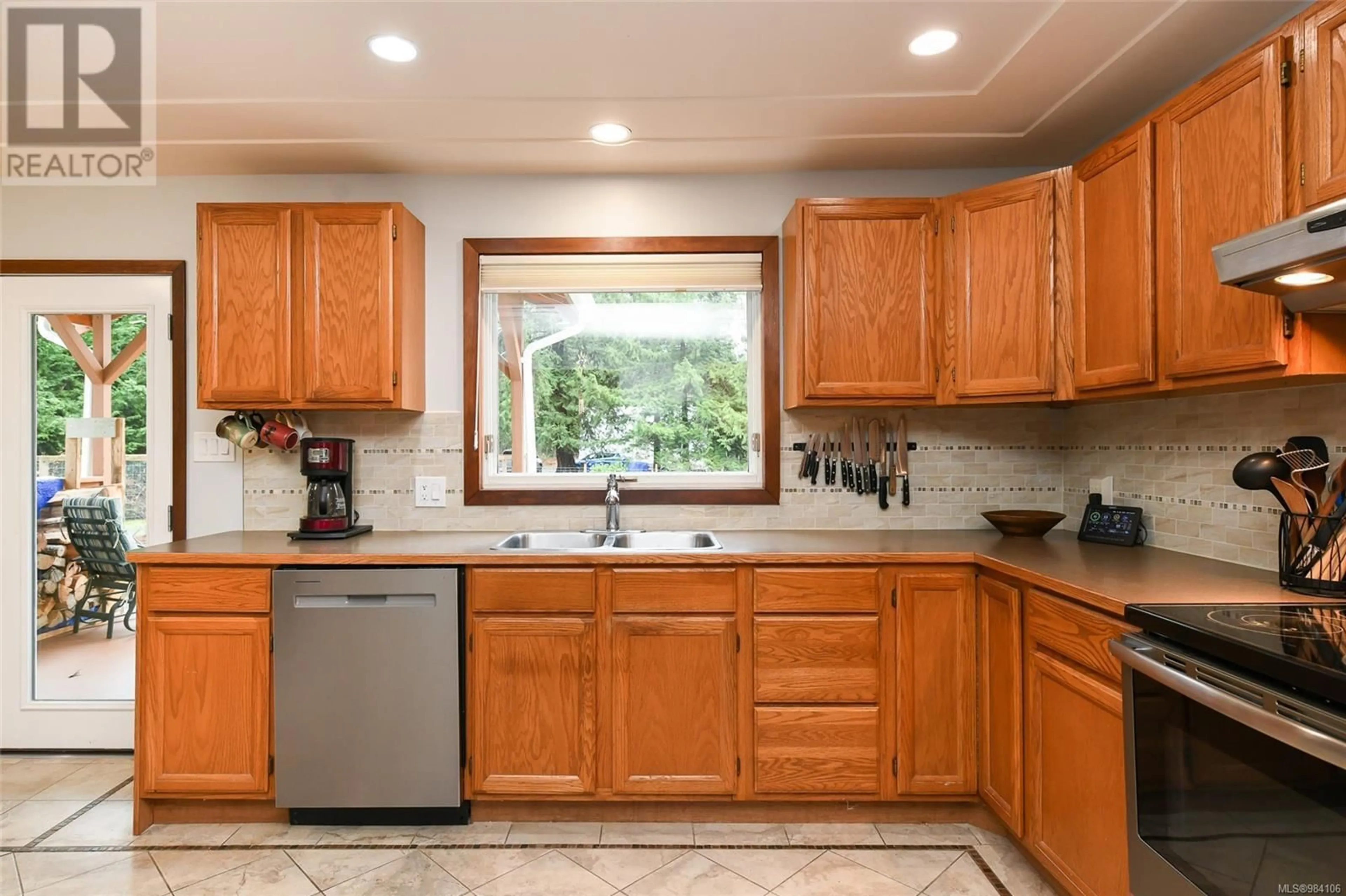 Standard kitchen, ceramic/tile floor for 385 Bates Dr, Fanny Bay British Columbia V0R1W0