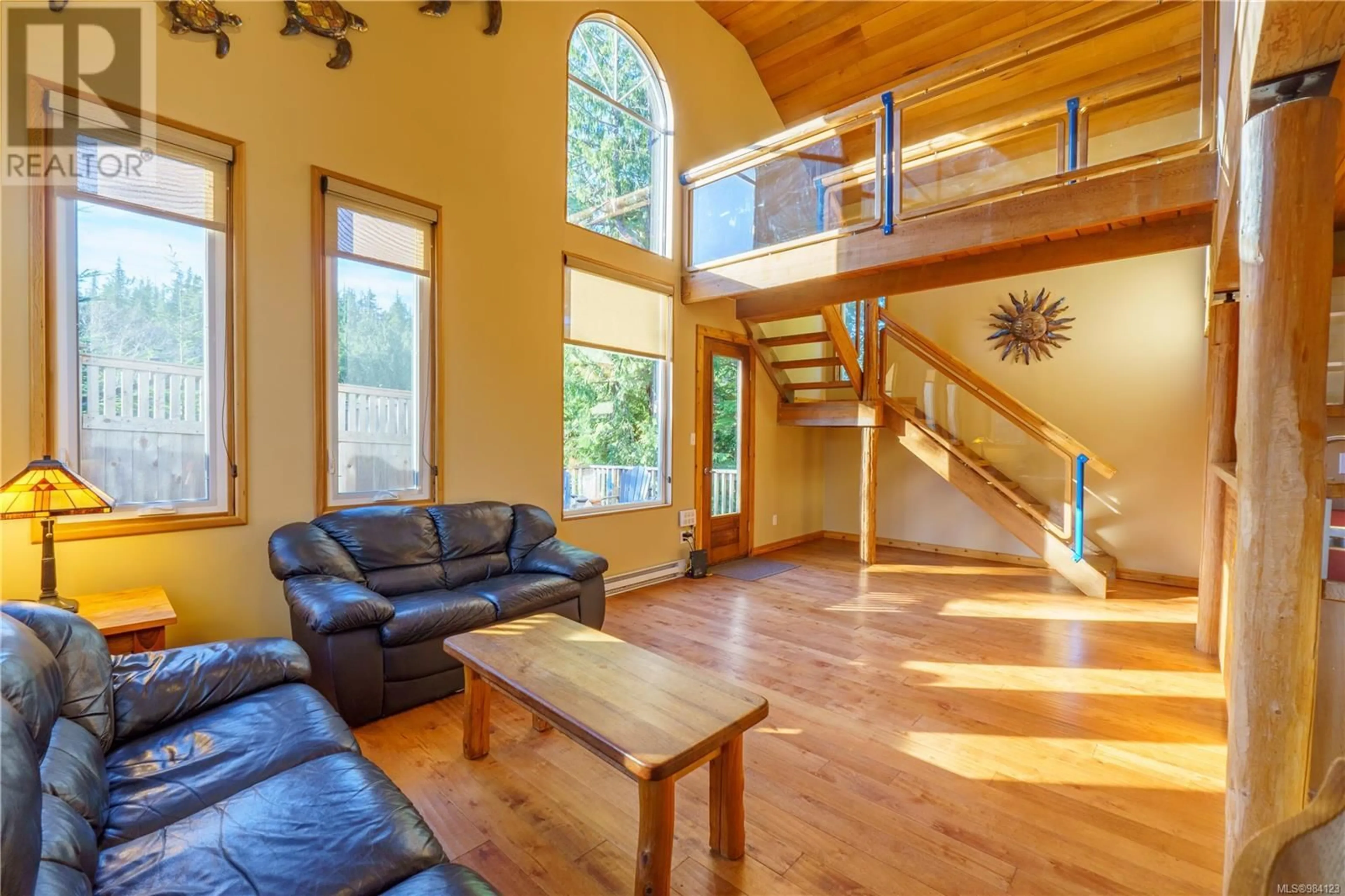 Living room with furniture, wood/laminate floor for 316 Leighton Way, Tofino British Columbia V0R2Z0