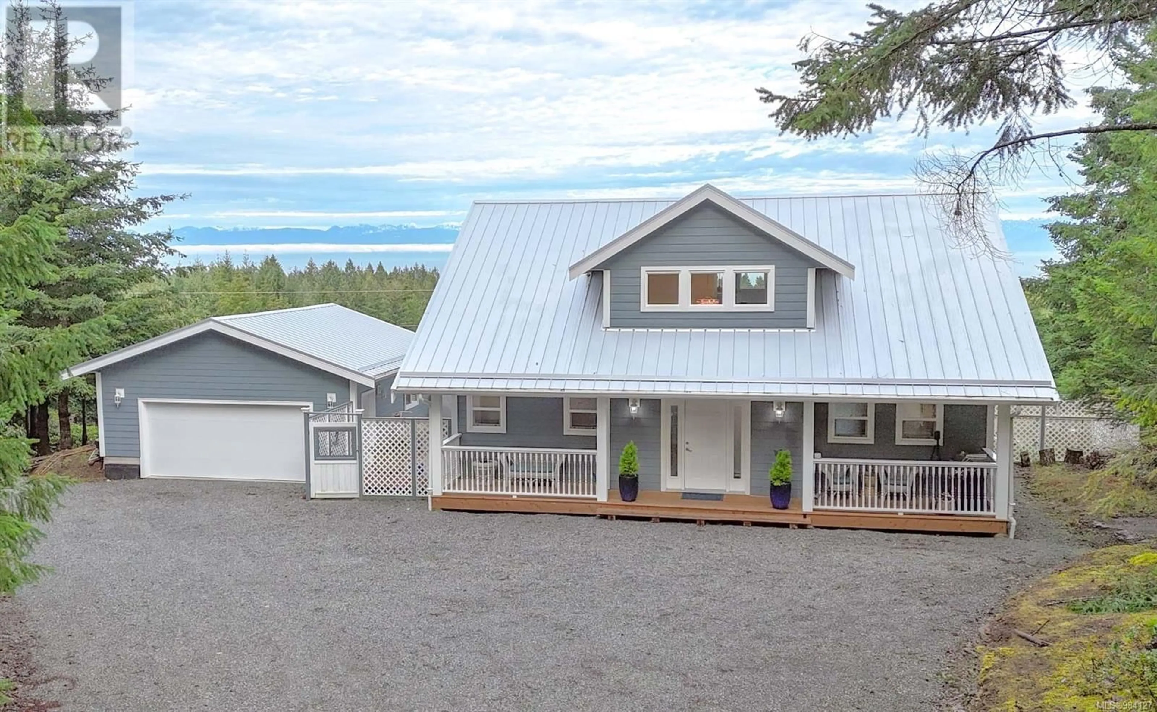 Home with vinyl exterior material, mountain view for 1886 Seymour Rd, Gabriola Island British Columbia V0R1X6