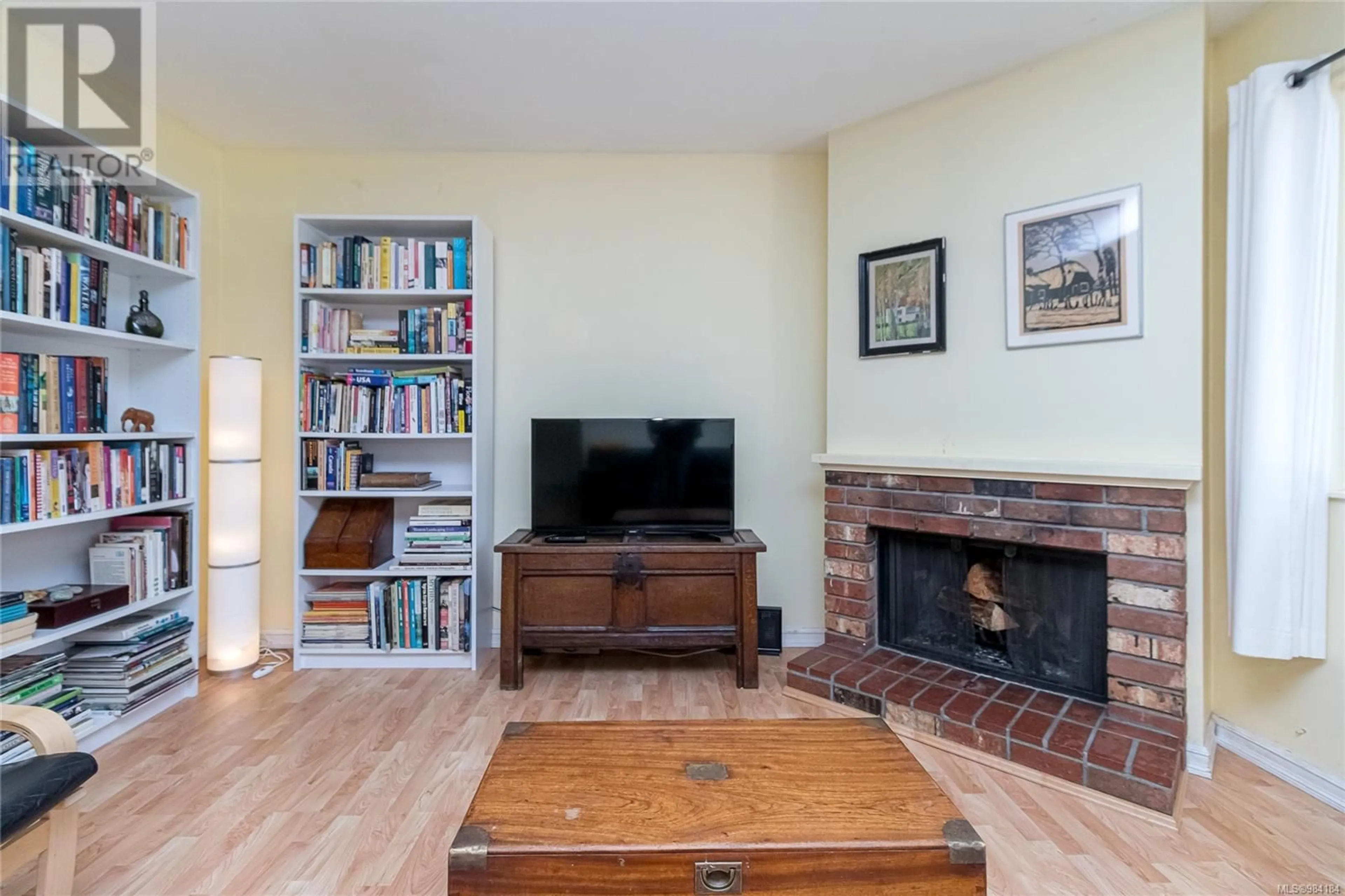 Living room with furniture, wood/laminate floor for 3025 Metchosin Rd, Colwood British Columbia V9C1Y8