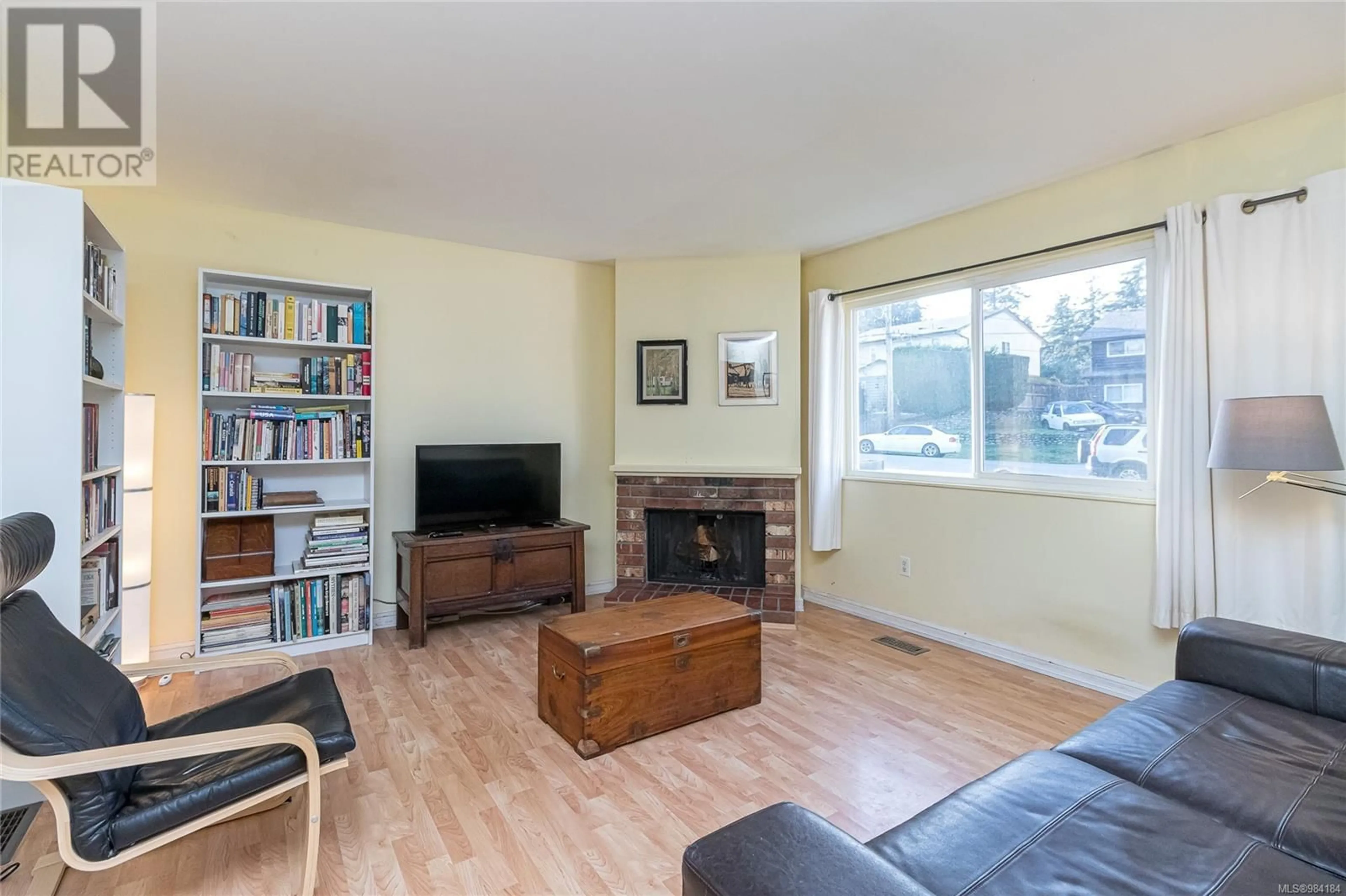 Living room with furniture, wood/laminate floor for 3025 Metchosin Rd, Colwood British Columbia V9C1Y8