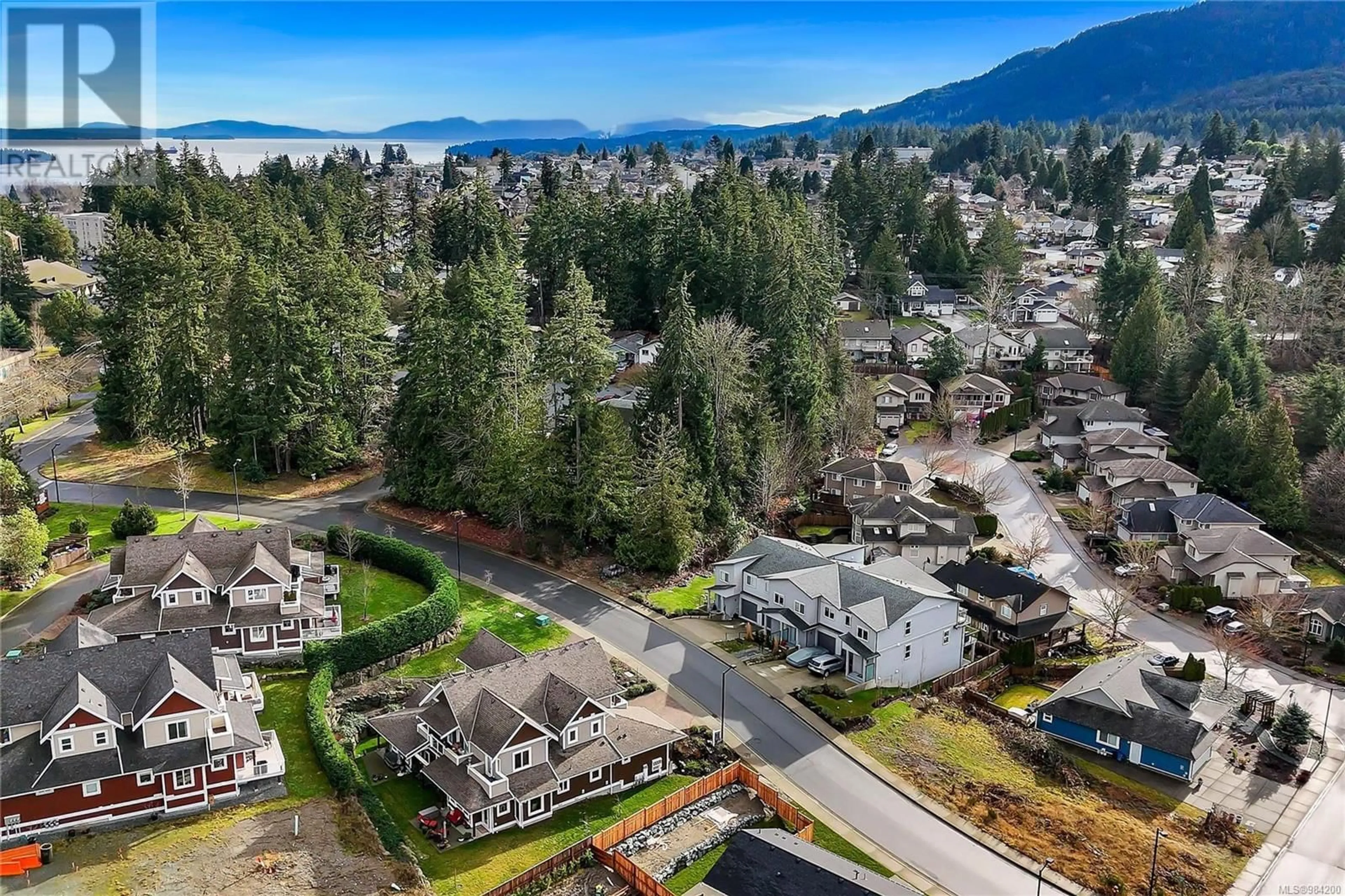 A pic from outside/outdoor area/front of a property/back of a property/a pic from drone, mountain view for 10 420 Cook St, Ladysmith British Columbia V9G1P8