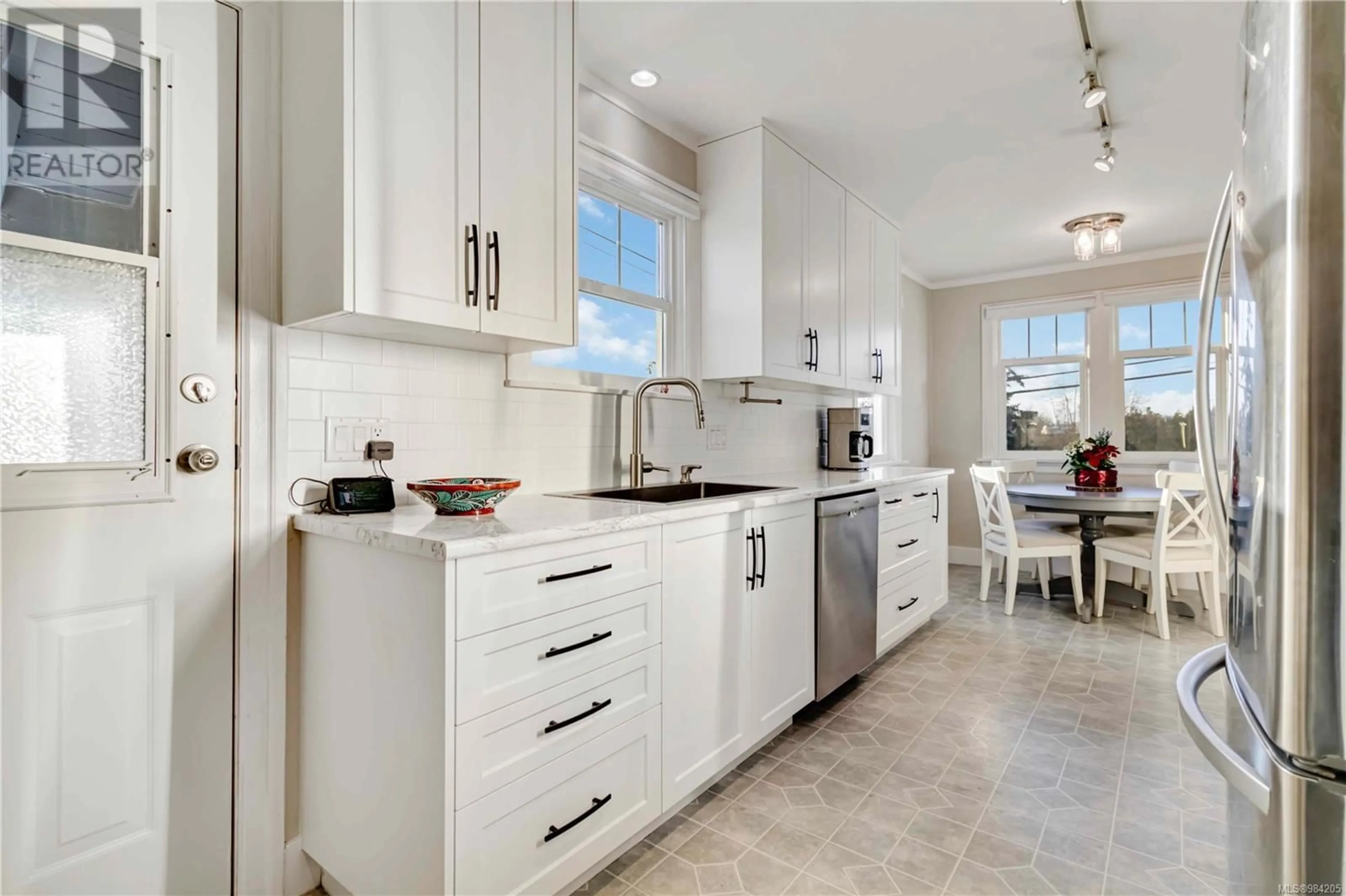 Open concept kitchen, ceramic/tile floor for 878 Darwin Ave, Saanich British Columbia V8X2X6