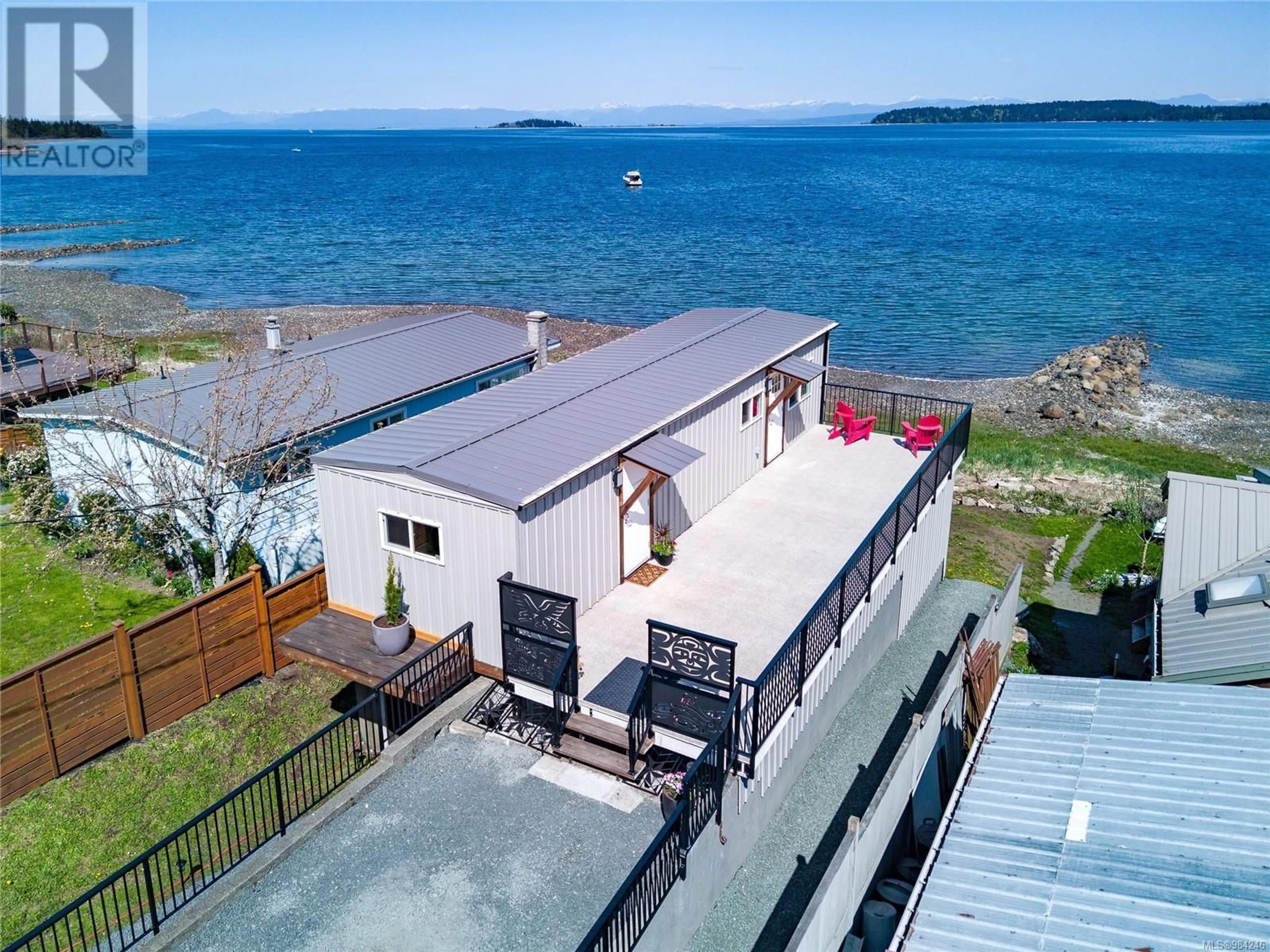 A pic from outside/outdoor area/front of a property/back of a property/a pic from drone, water/lake/river/ocean view for 5624 Island Hwy S, Union Bay British Columbia V0R3B0