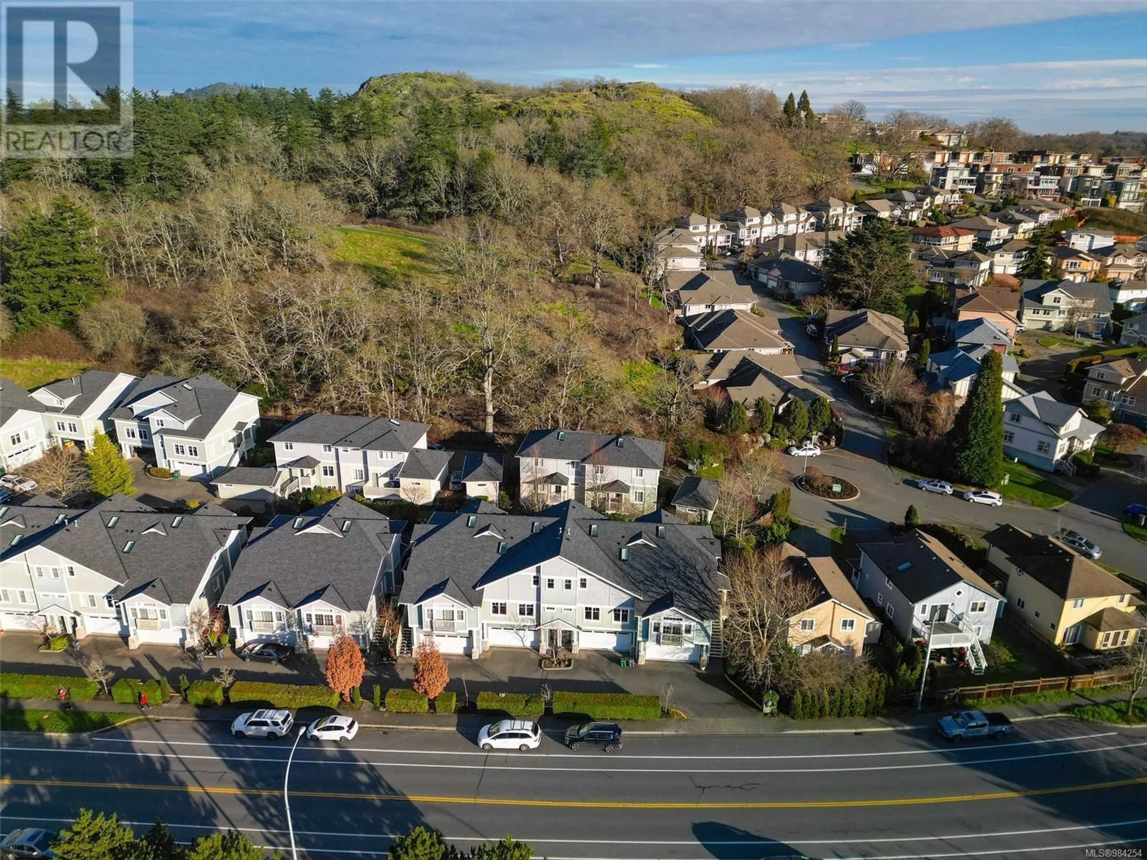 A pic from outside/outdoor area/front of a property/back of a property/a pic from drone, street for 3 4079 Douglas St, Saanich British Columbia V8X5M4