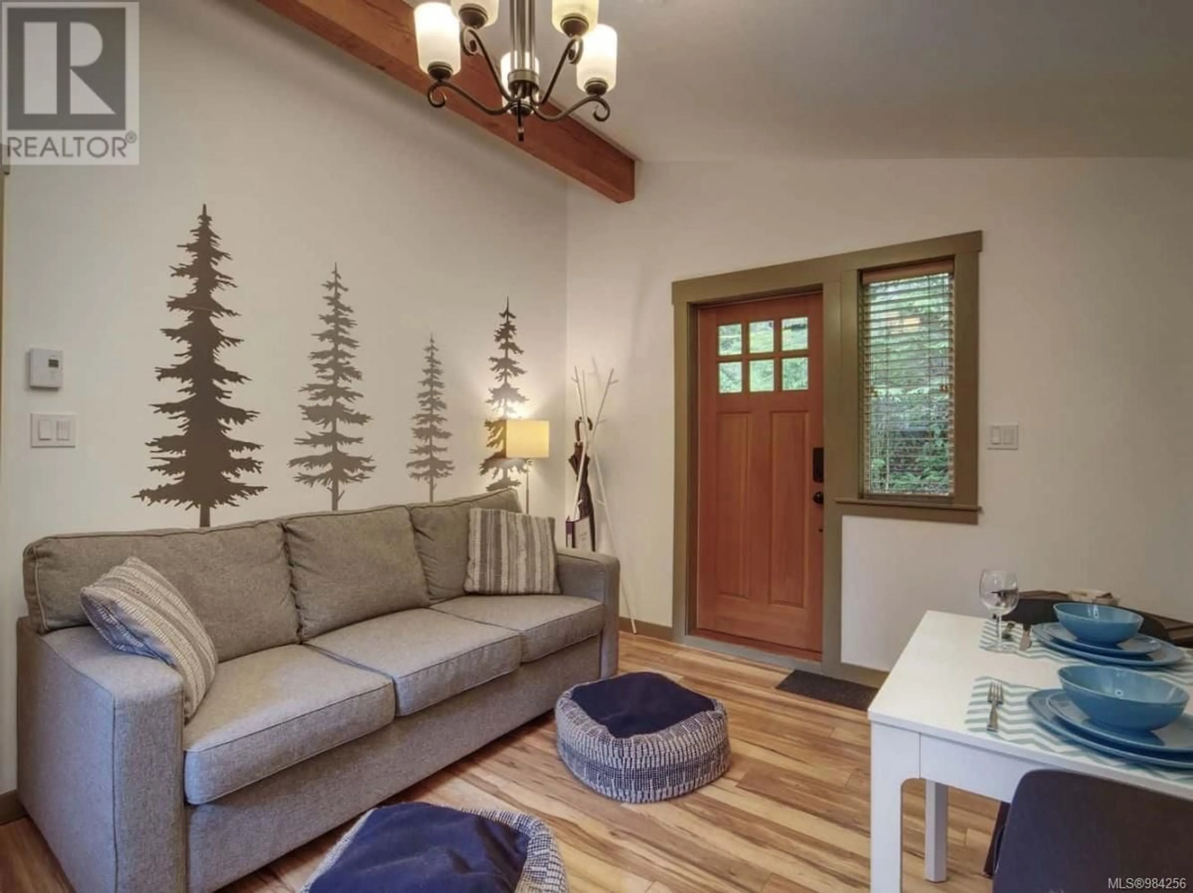 Living room with furniture, wood/laminate floor for 40 6574 Baird Rd, Port Renfrew British Columbia V0S1K0