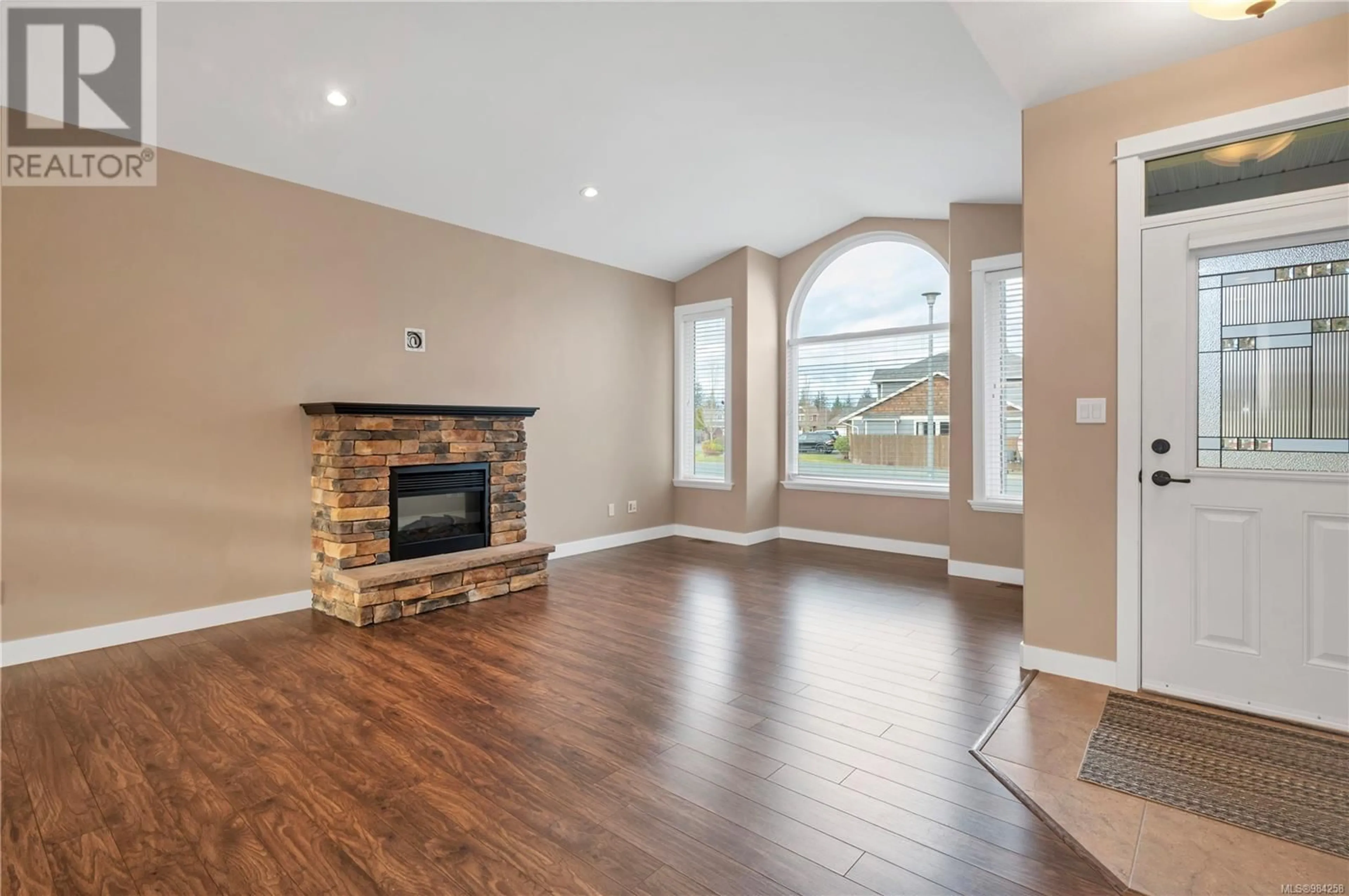 Living room with furniture, wood/laminate floor for 990 Cordero Cres, Campbell River British Columbia V9H0C3