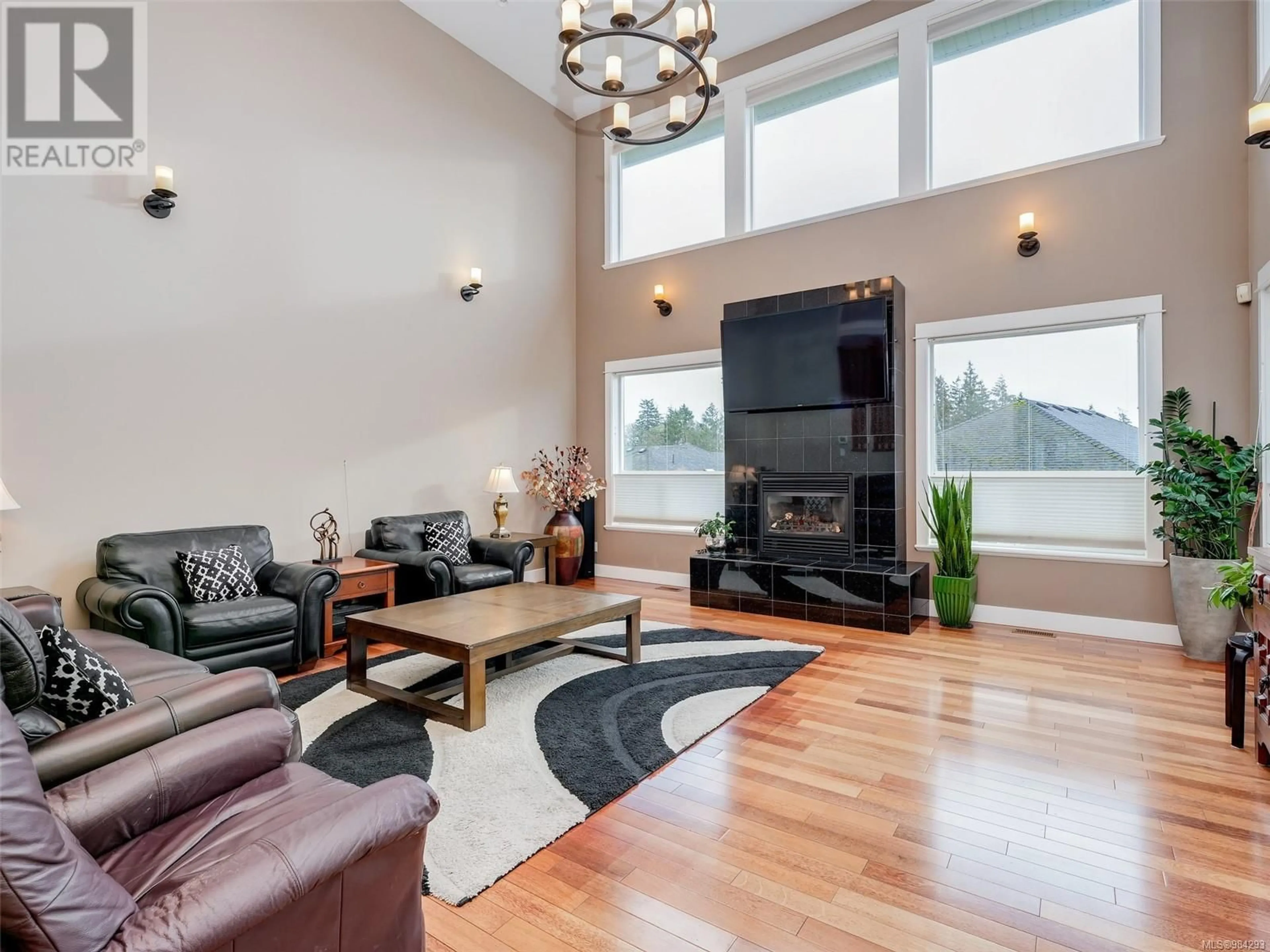 Living room with furniture, wood/laminate floor for 1025 Arngask Ave, Langford British Columbia V9B0G4