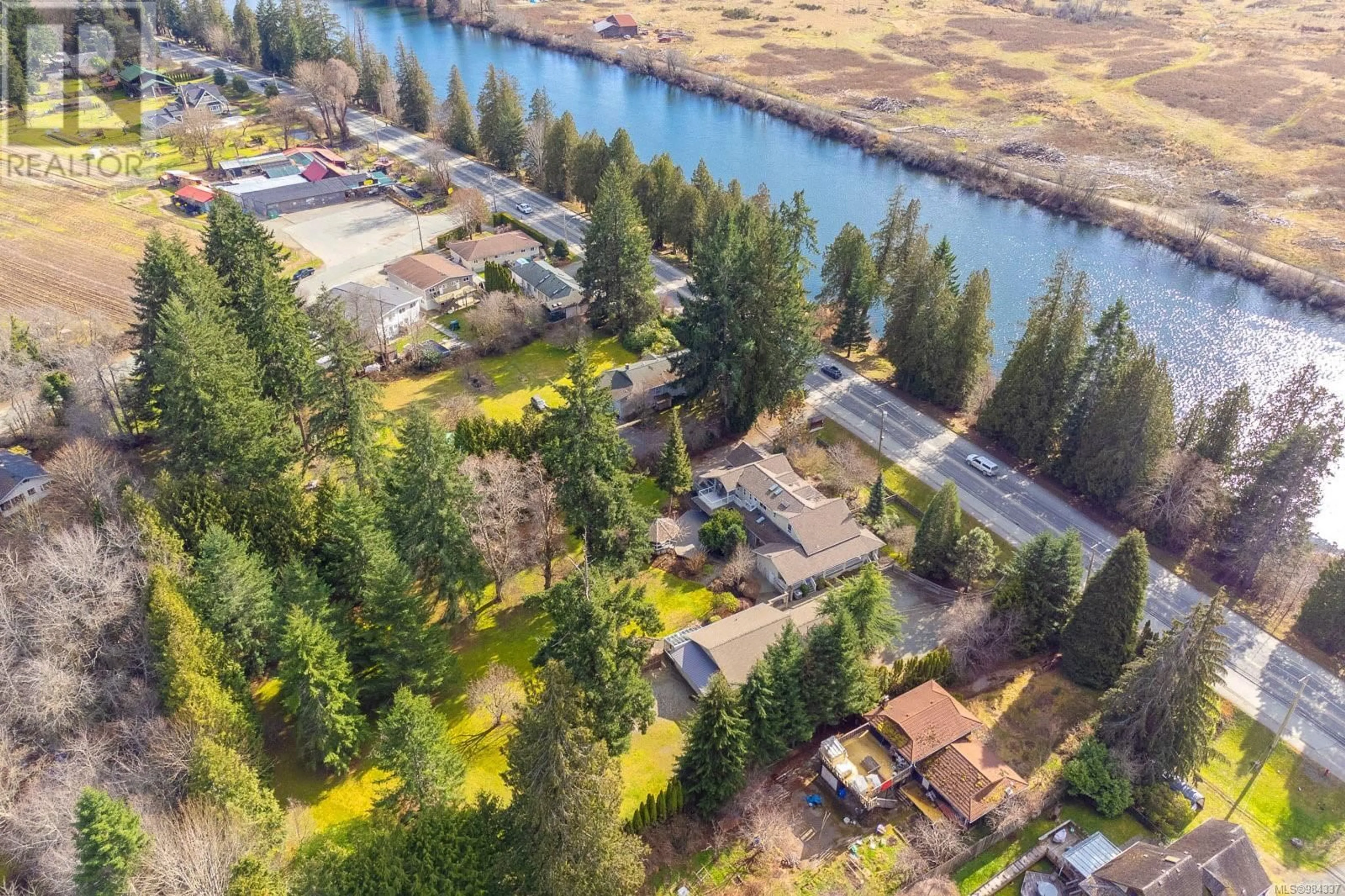 A pic from outside/outdoor area/front of a property/back of a property/a pic from drone, water/lake/river/ocean view for 5769 River Rd, Port Alberni British Columbia V9Y6Z5