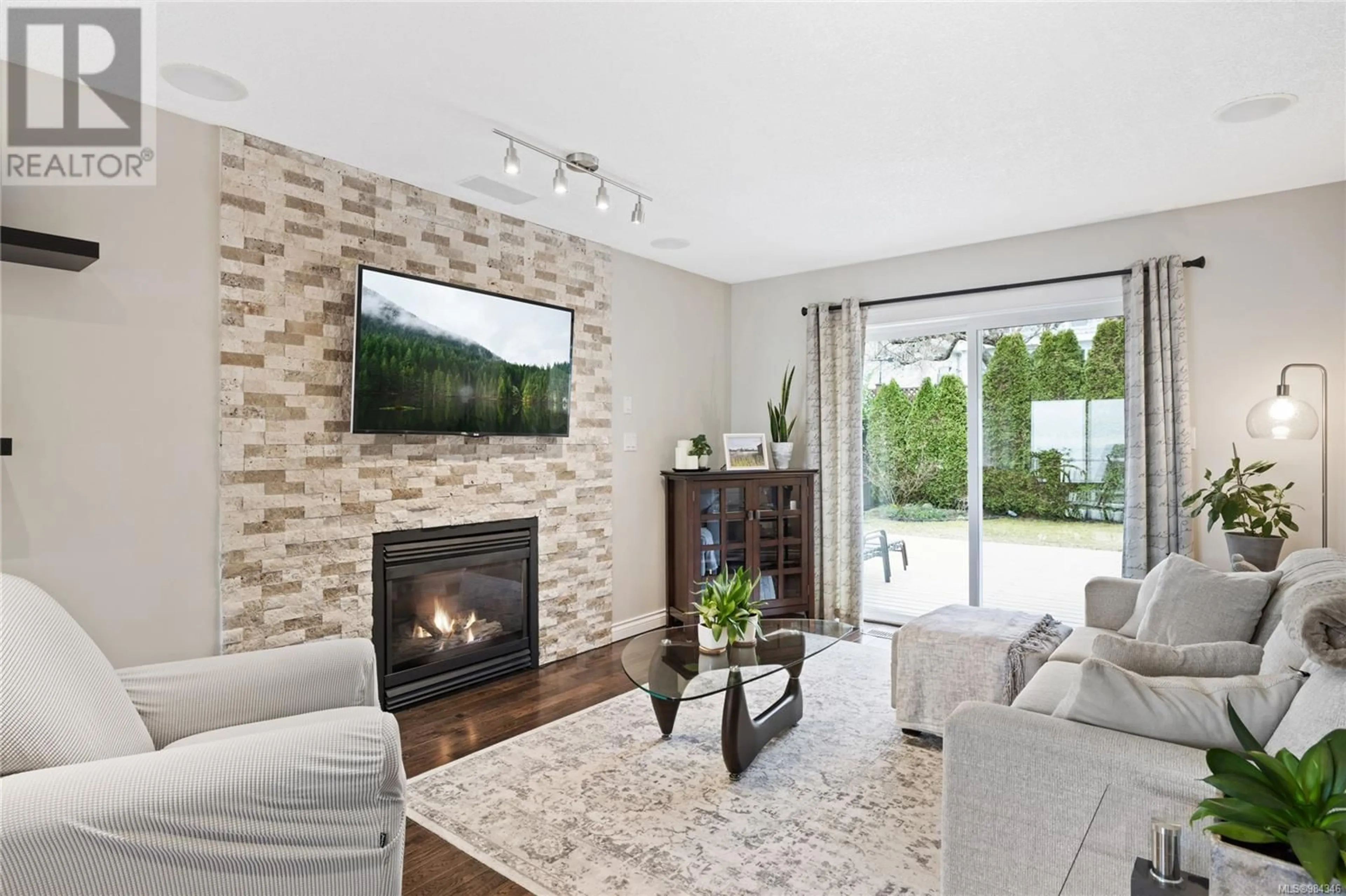 Living room with furniture, ceramic/tile floor for 6593 Pelican Way, Nanaimo British Columbia V9V1P9