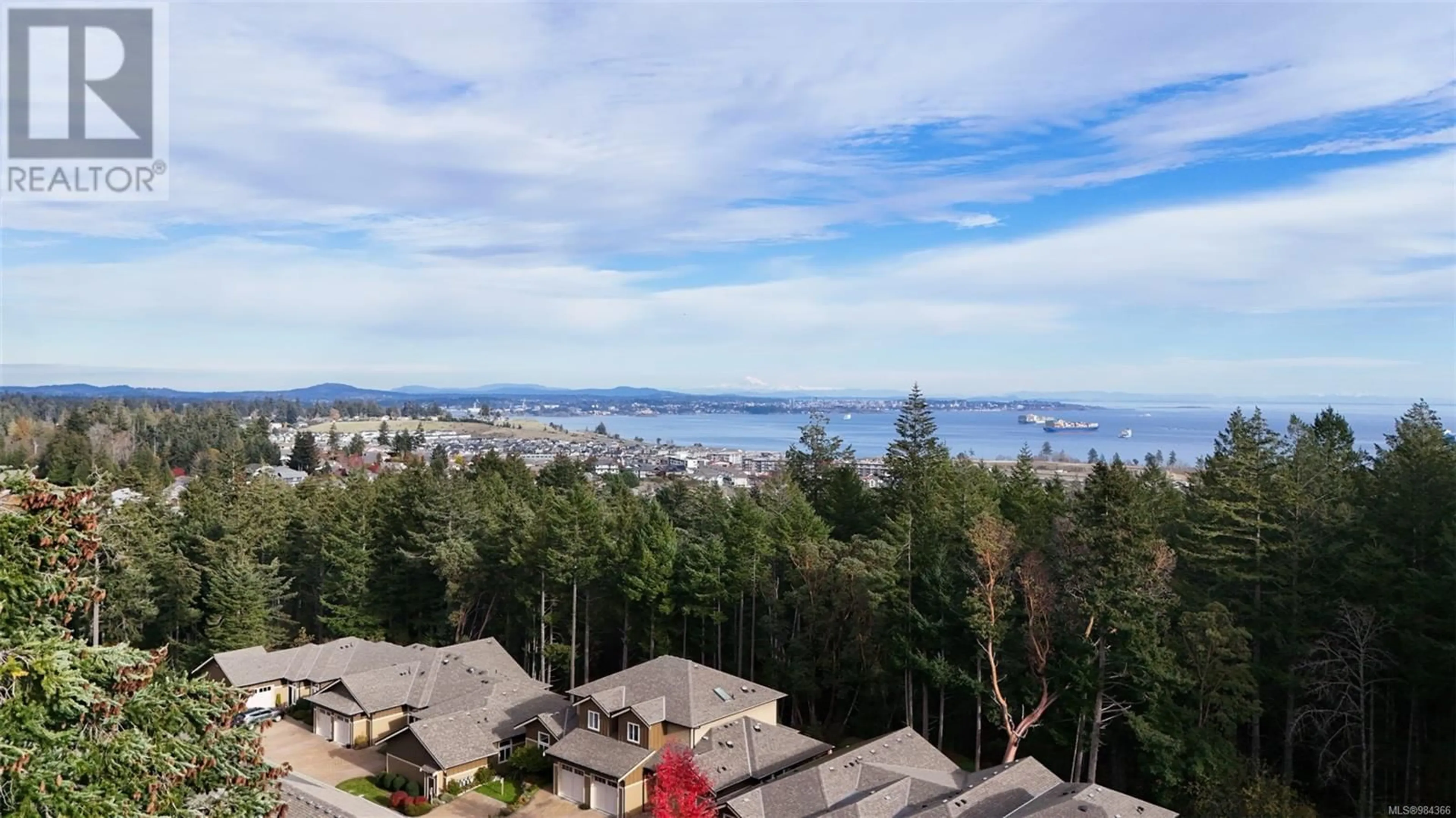 A pic from outside/outdoor area/front of a property/back of a property/a pic from drone, mountain view for 105 3640 Propeller Pl, Colwood British Columbia V9C0G1