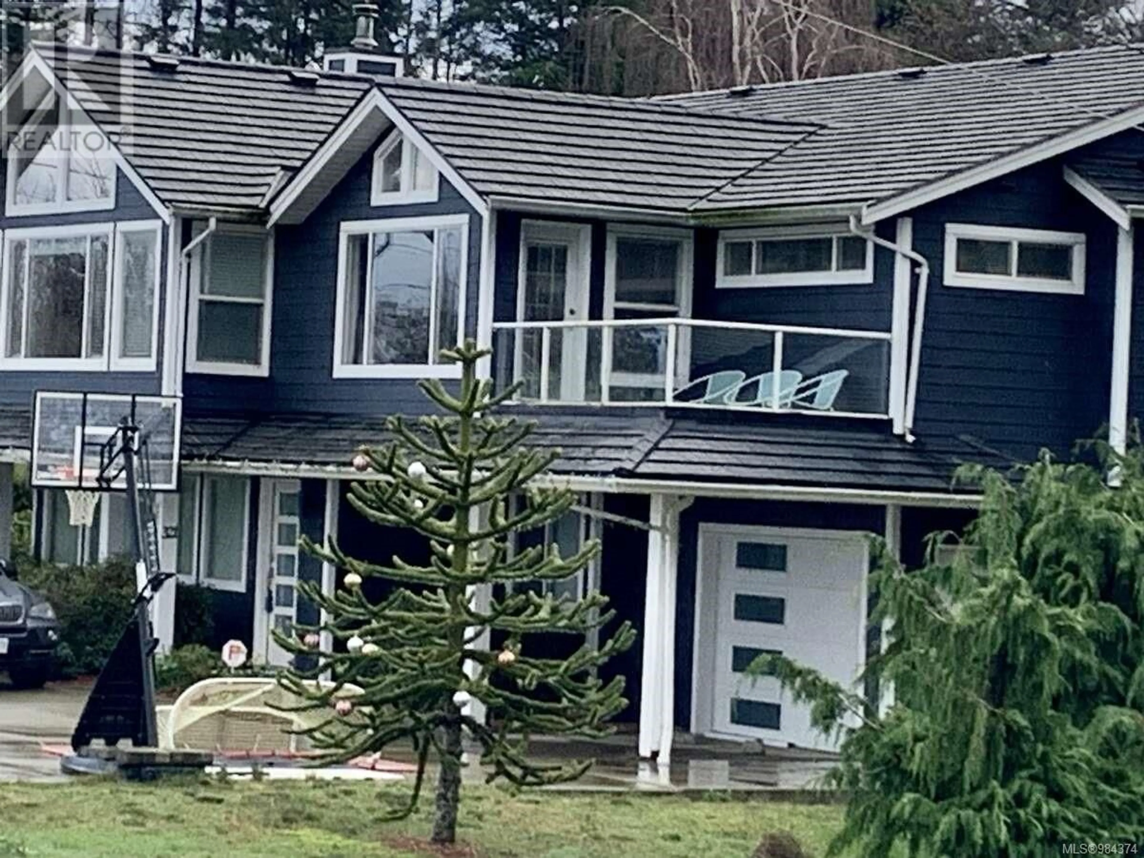 Home with vinyl exterior material, mountain view for 321 Wireless Rd, Comox British Columbia V9M3T6