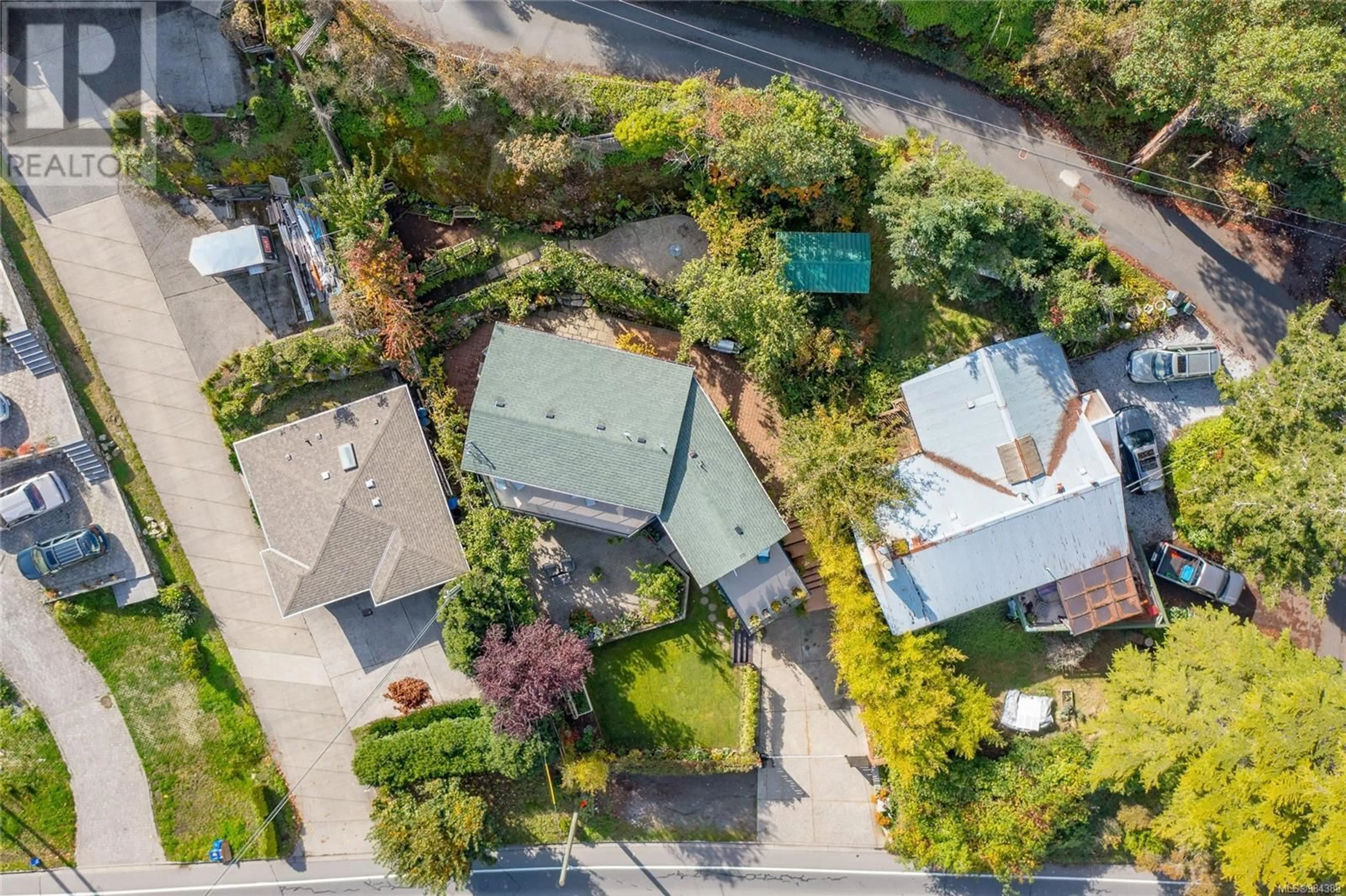 A pic from outside/outdoor area/front of a property/back of a property/a pic from drone, street for 4572 Cordova Bay Rd, Saanich British Columbia V8X3V5