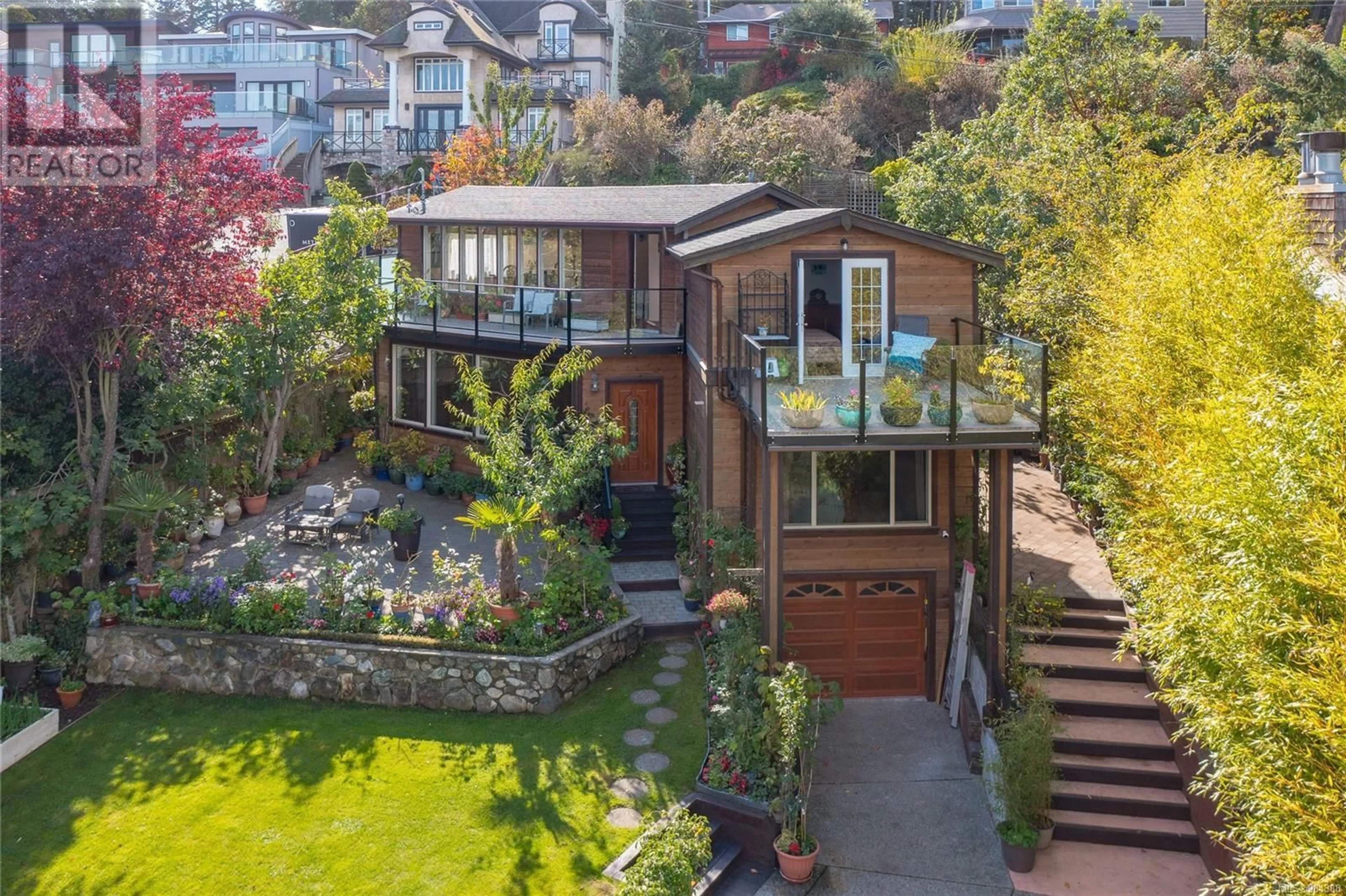 A pic from outside/outdoor area/front of a property/back of a property/a pic from drone, street for 4572 Cordova Bay Rd, Saanich British Columbia V8X3V5