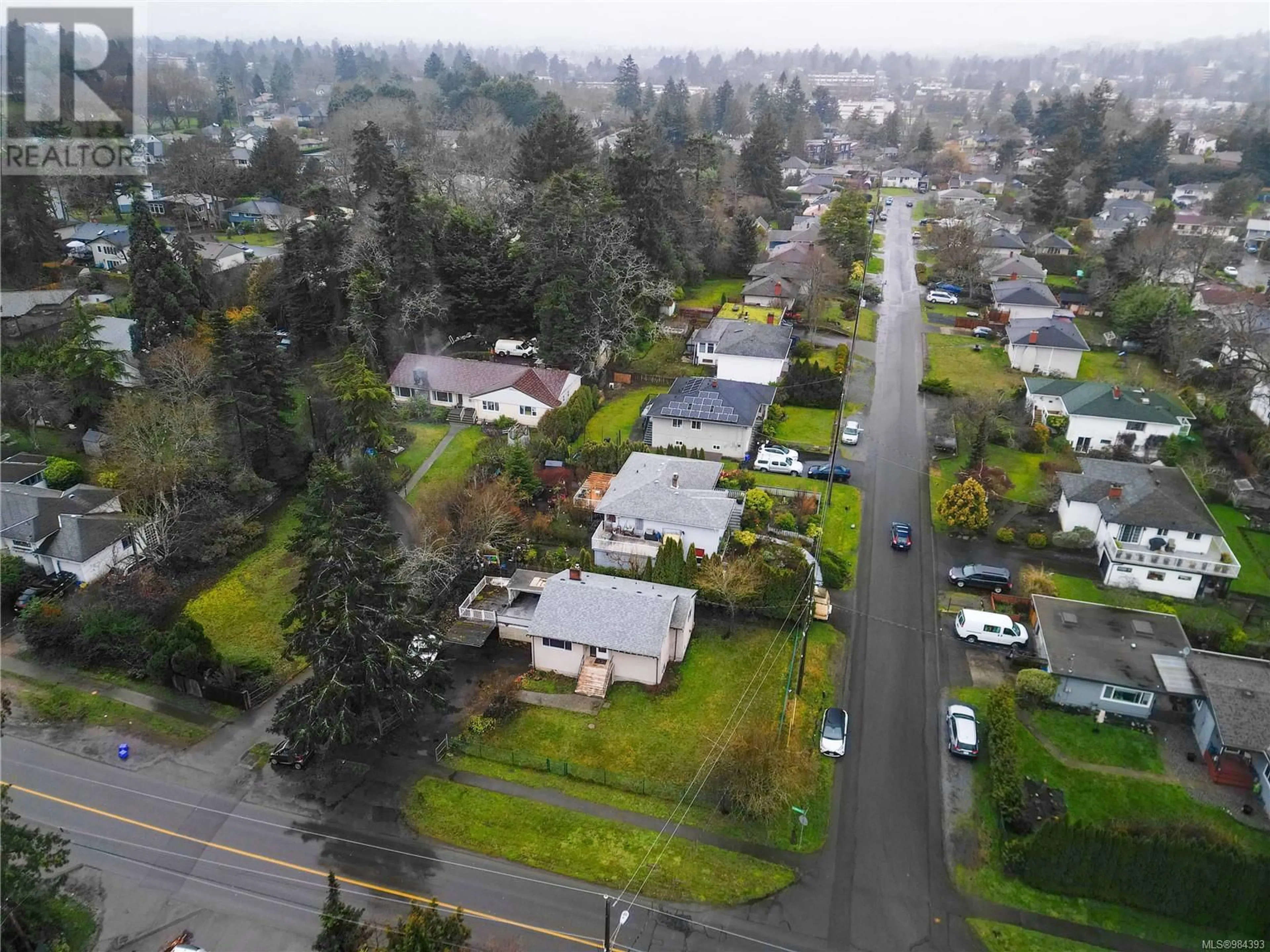 A pic from outside/outdoor area/front of a property/back of a property/a pic from drone, street for 3984 Blenkinsop Rd, Saanich British Columbia V8P3P9