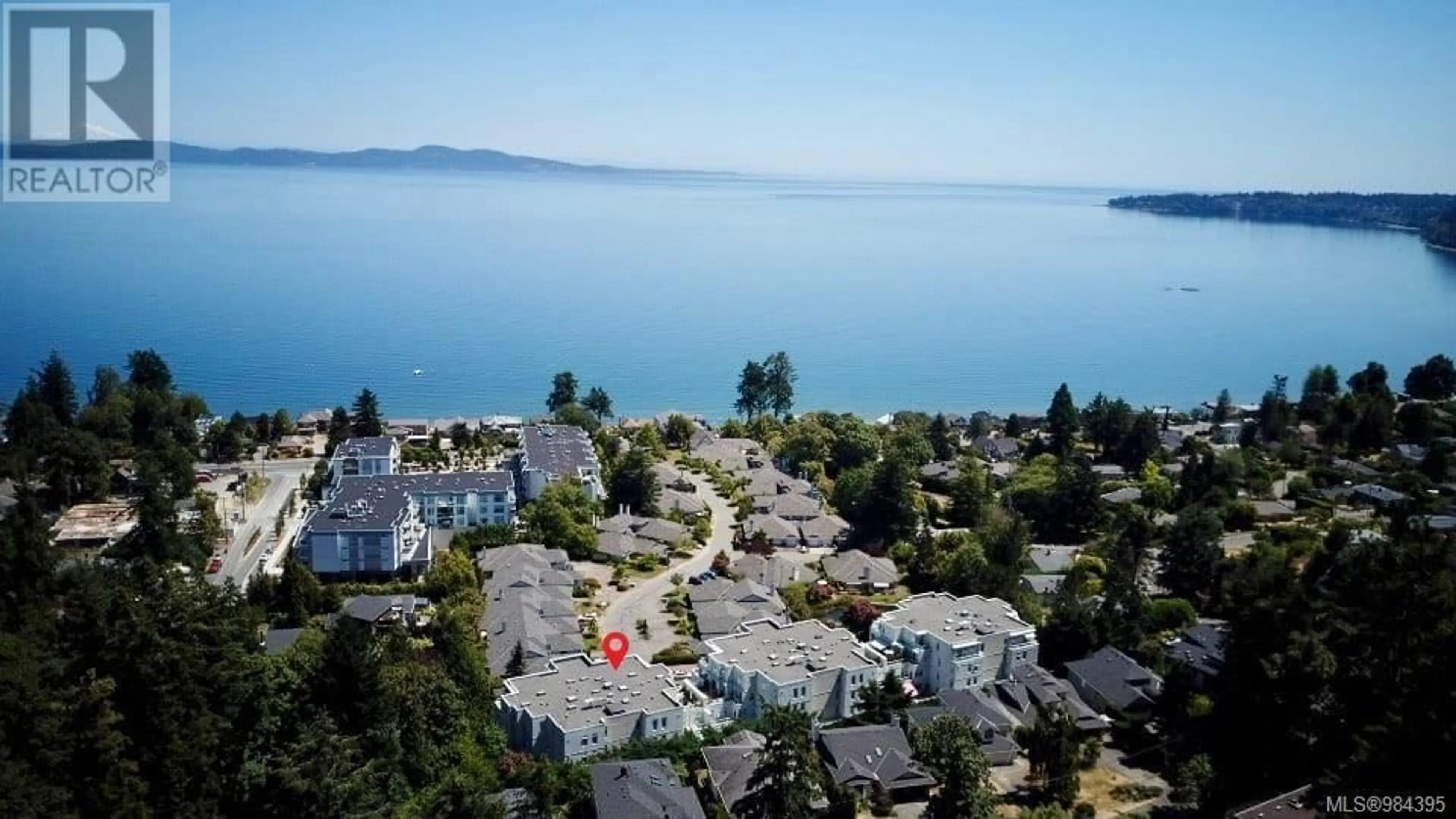 A pic from outside/outdoor area/front of a property/back of a property/a pic from drone, water/lake/river/ocean view for 408 5110 Cordova Bay Rd, Saanich British Columbia V8Y2K5