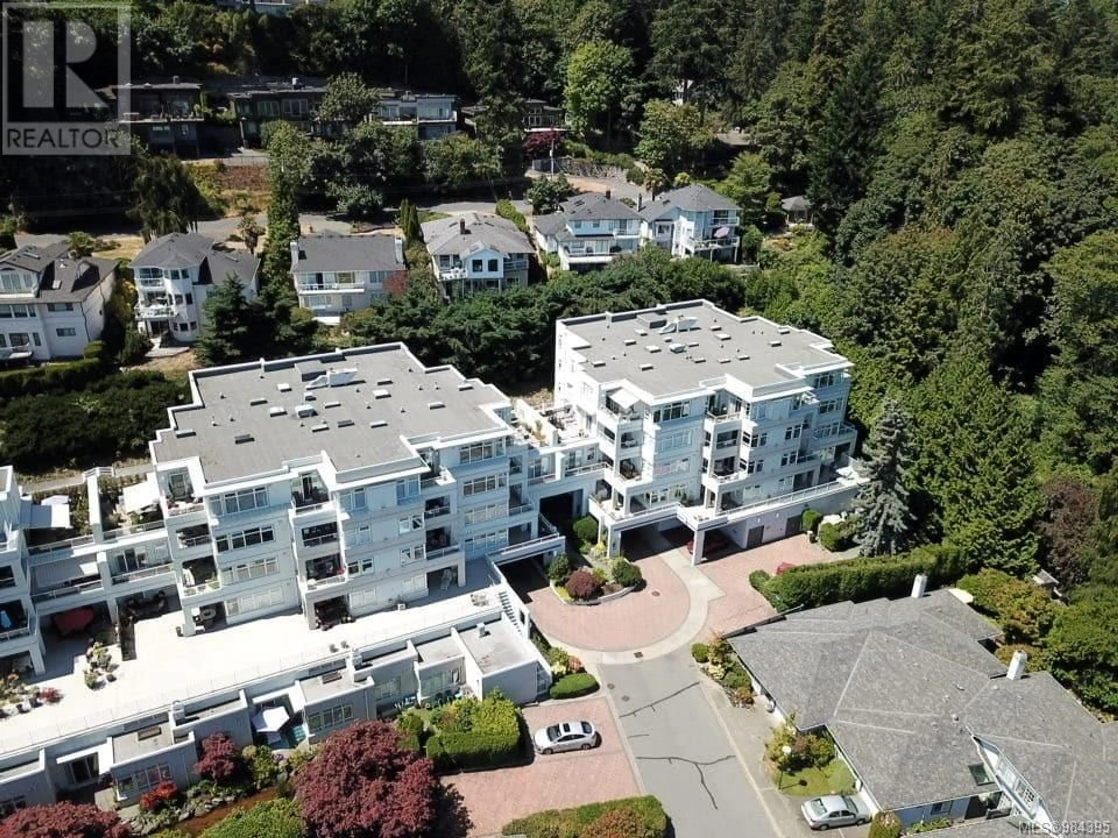 A pic from outside/outdoor area/front of a property/back of a property/a pic from drone, unknown for 408 5110 Cordova Bay Rd, Saanich British Columbia V8Y2K5