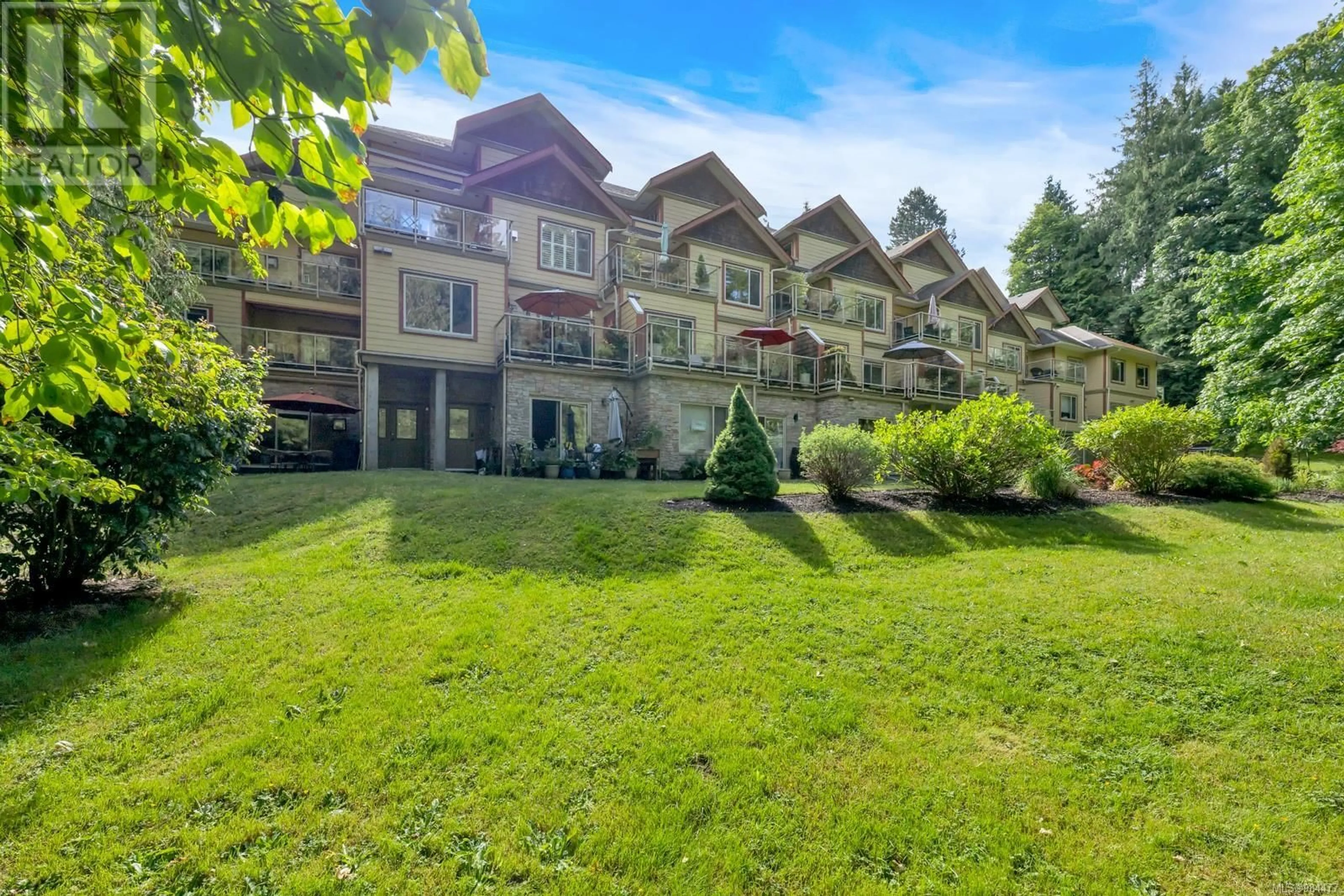 A pic from outside/outdoor area/front of a property/back of a property/a pic from drone, mountain view for 310 1244 4th Ave, Ladysmith British Columbia V9G0A6