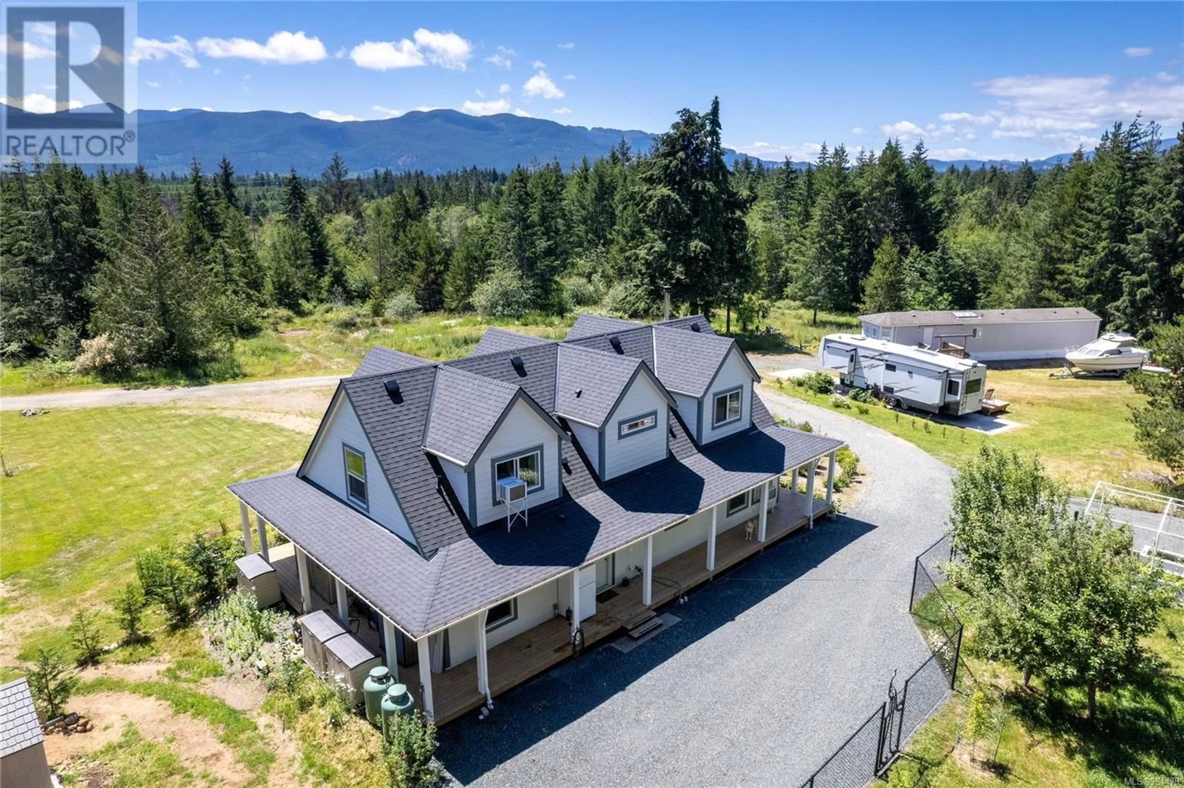 A pic from outside/outdoor area/front of a property/back of a property/a pic from drone, mountain view for 450 & 460 Rembar Rd, Qualicum Beach British Columbia V9K2A4