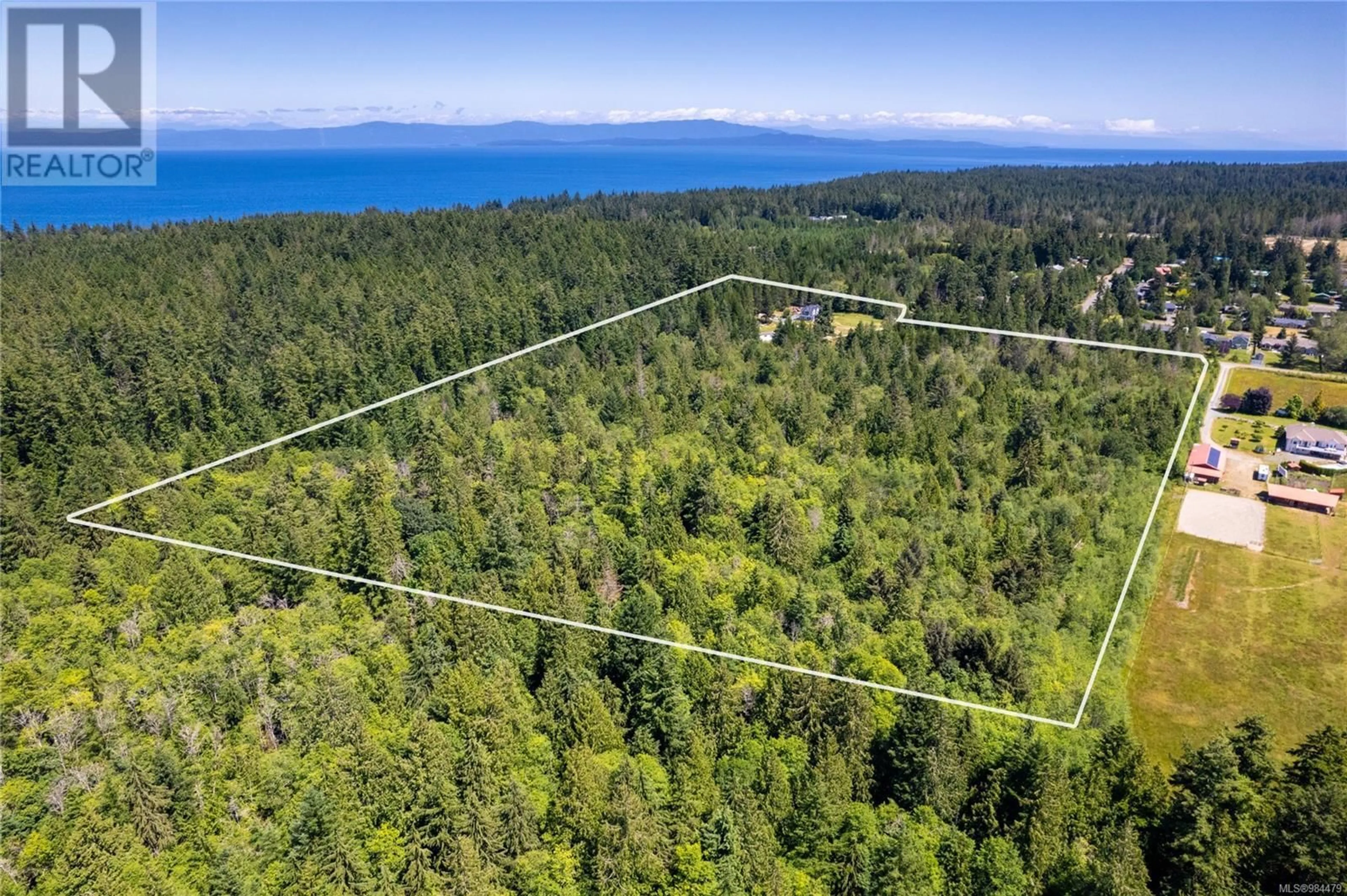 A pic from outside/outdoor area/front of a property/back of a property/a pic from drone, forest/trees view for 450 & 460 Rembar Rd, Qualicum Beach British Columbia V9K2A4